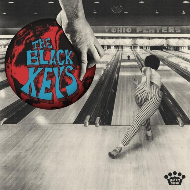 Albumcover: Eine große Hand mit einer Bowlingkugel über einer Bowlingbahn mit einem Bowler im Hintergrund.