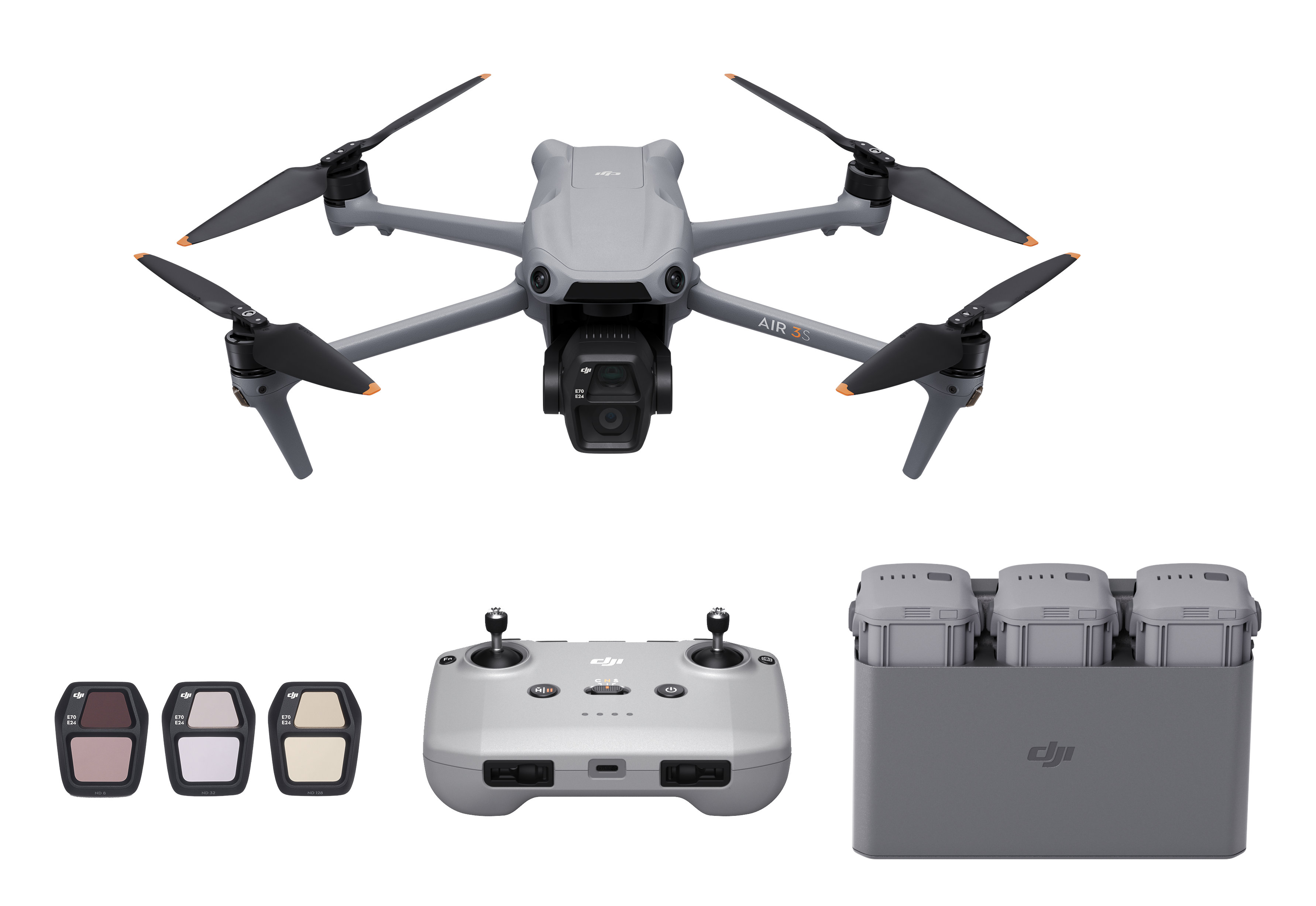 Dron z kamerą, kontrolerem, dodatkowymi bateriami i filtrami.