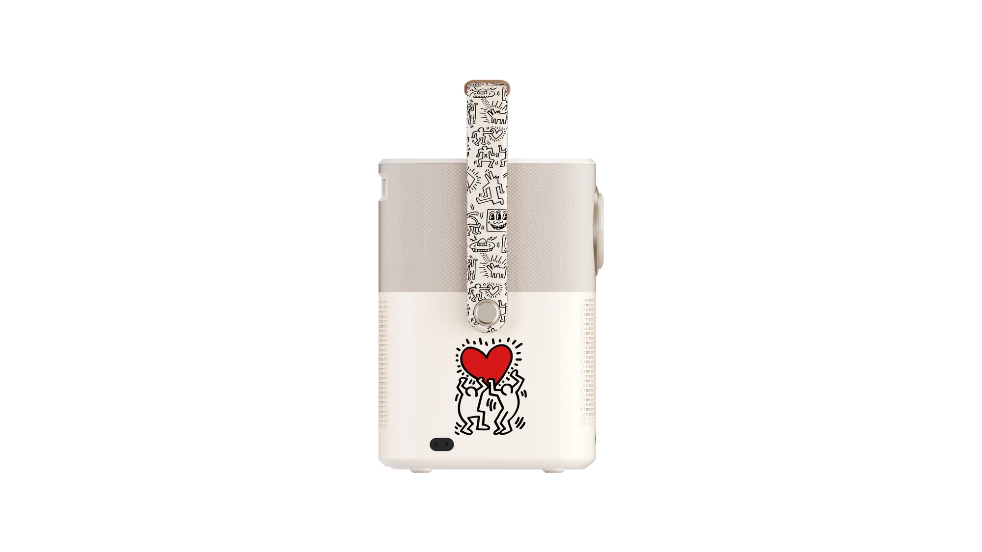 Ein weißer und beiger Projektor mit einem Keith Haring-Design, das ein rotes Herz und Figuren zeigt.