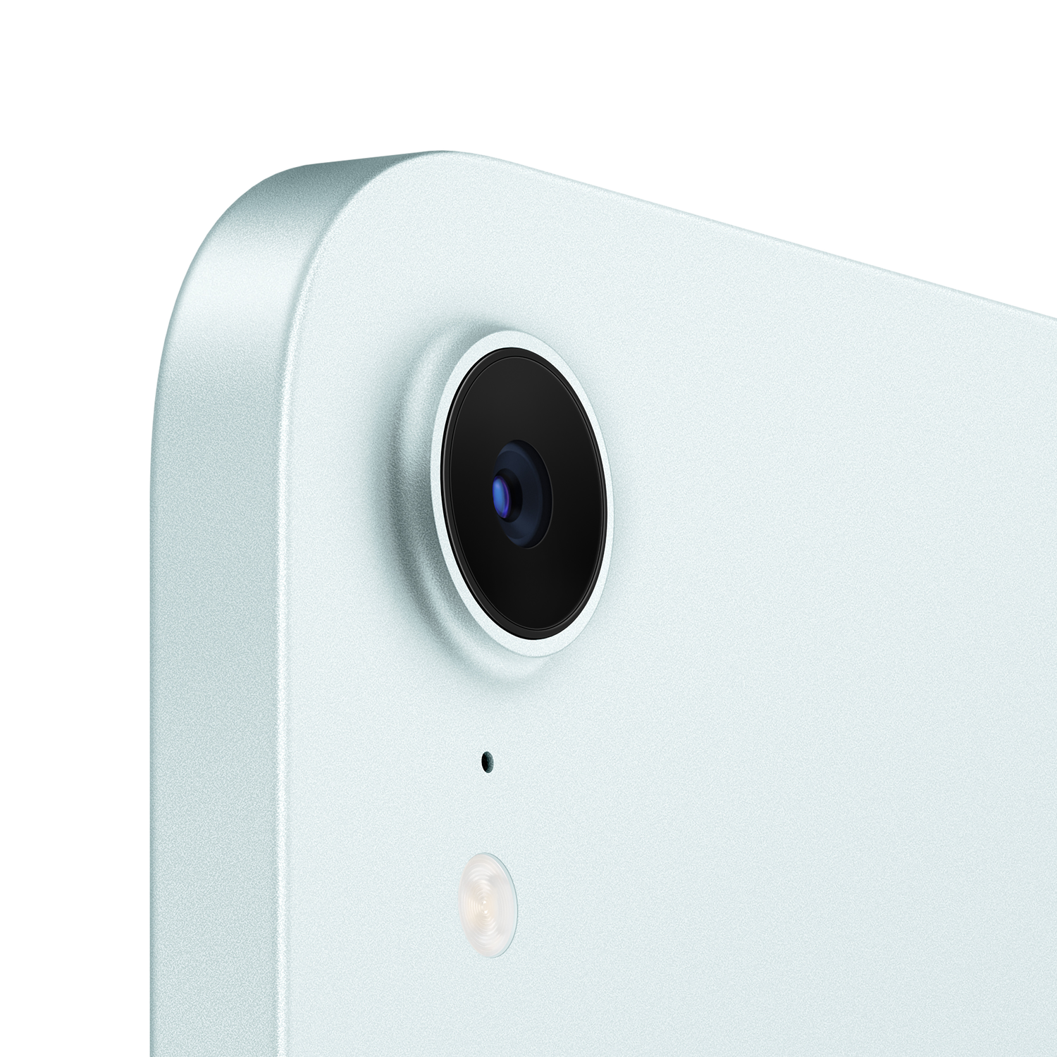 Close-up of a tablet camera lens, flash, and microphone on a light blue surface.