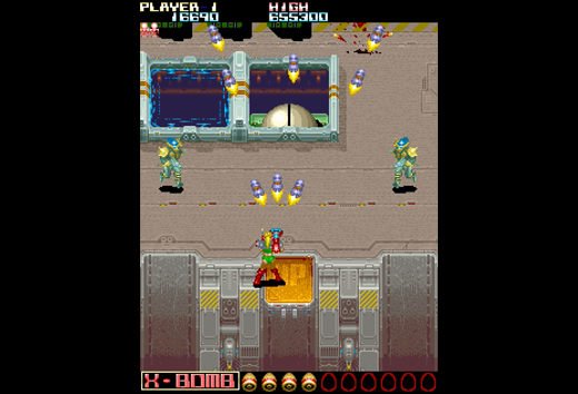 Retro-Arcade-Spielbildschirm: eine grüne Figur schießt nach oben auf fliegende Raketen. Highscore angezeigt.