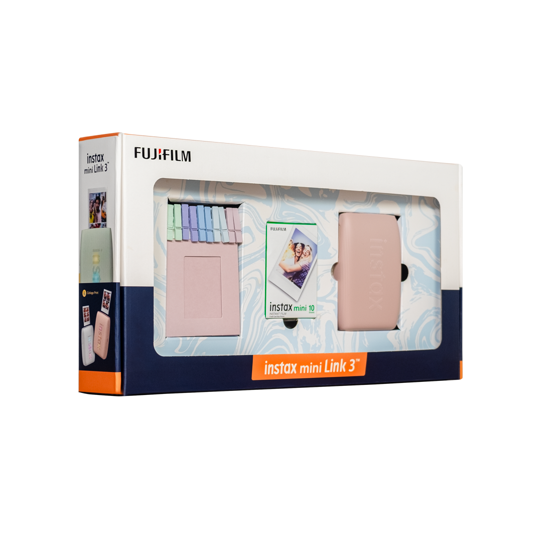 Renkli bir kutuda pembe bir Instax Mini Link 3 fotoğraf yazıcısı ve aksesuarları.