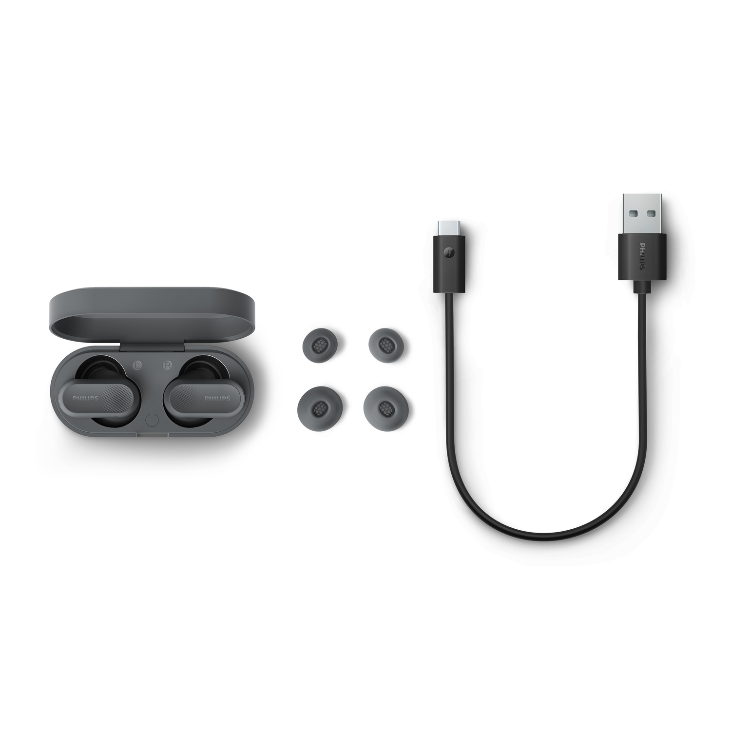 Earbuds in a case, spare ear tips, and a charging cable, all on a white background.