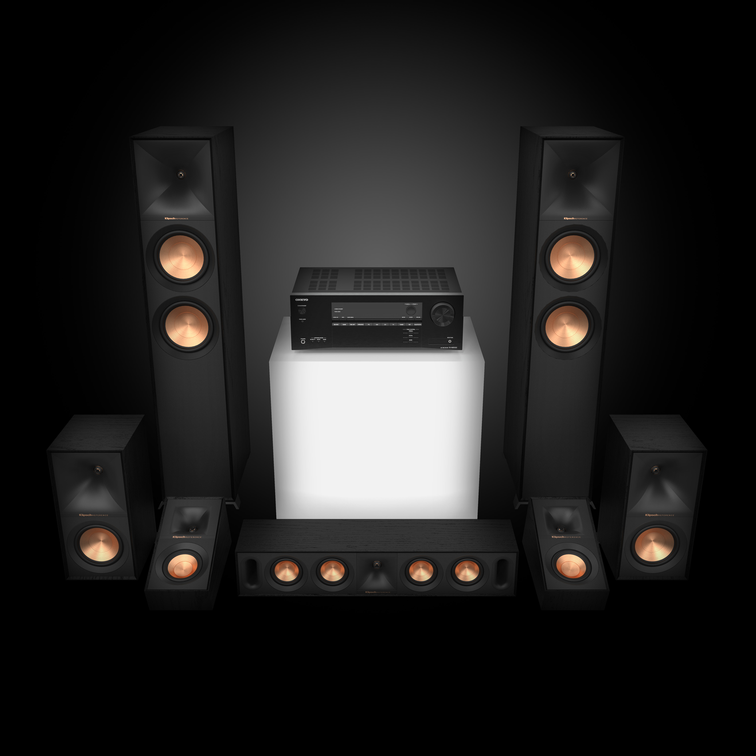 A black home theater system. Speakers, a receiver, and a subwoofer are arranged.