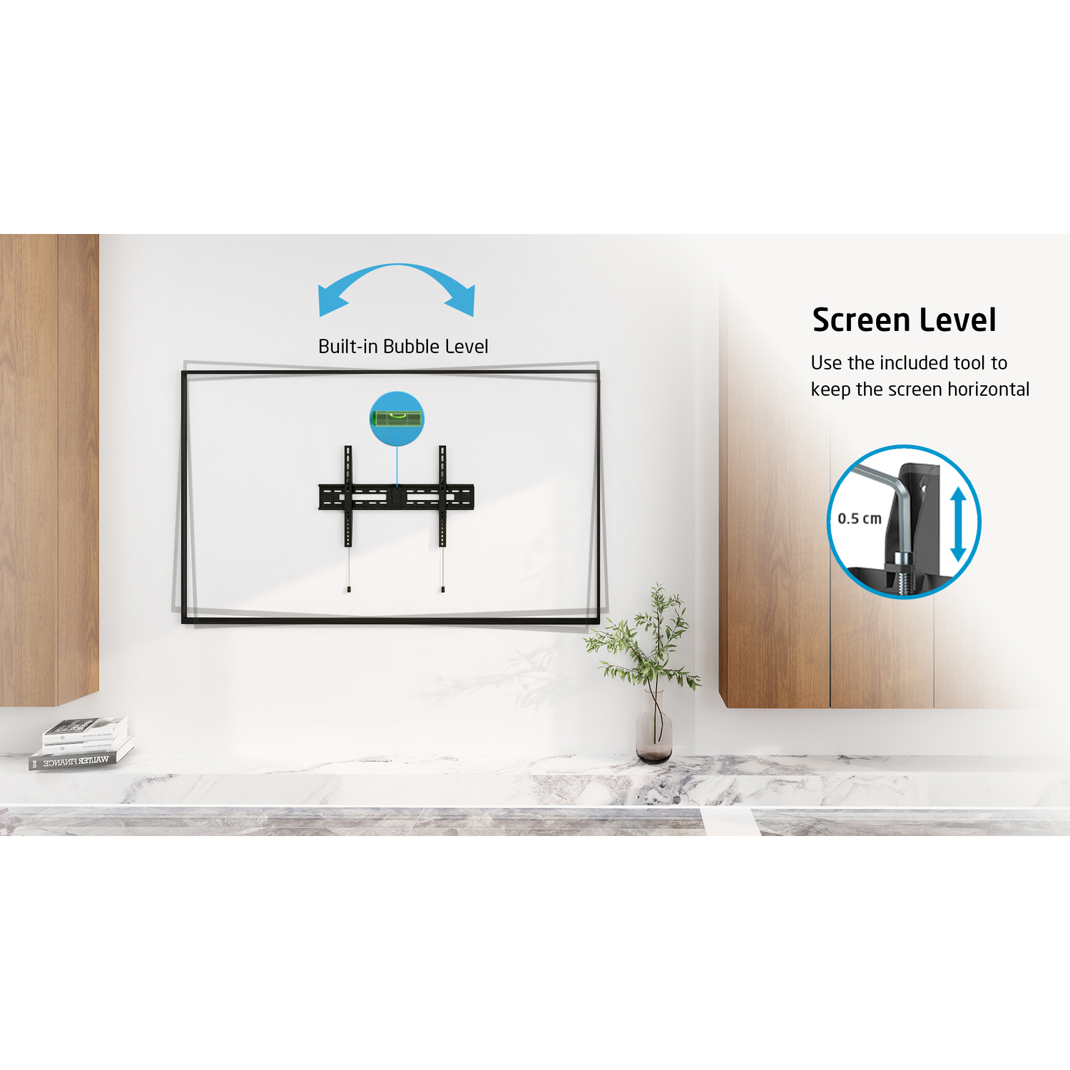 Une télévision fixée au mur blanc, avec un niveau à bulle et des instructions.