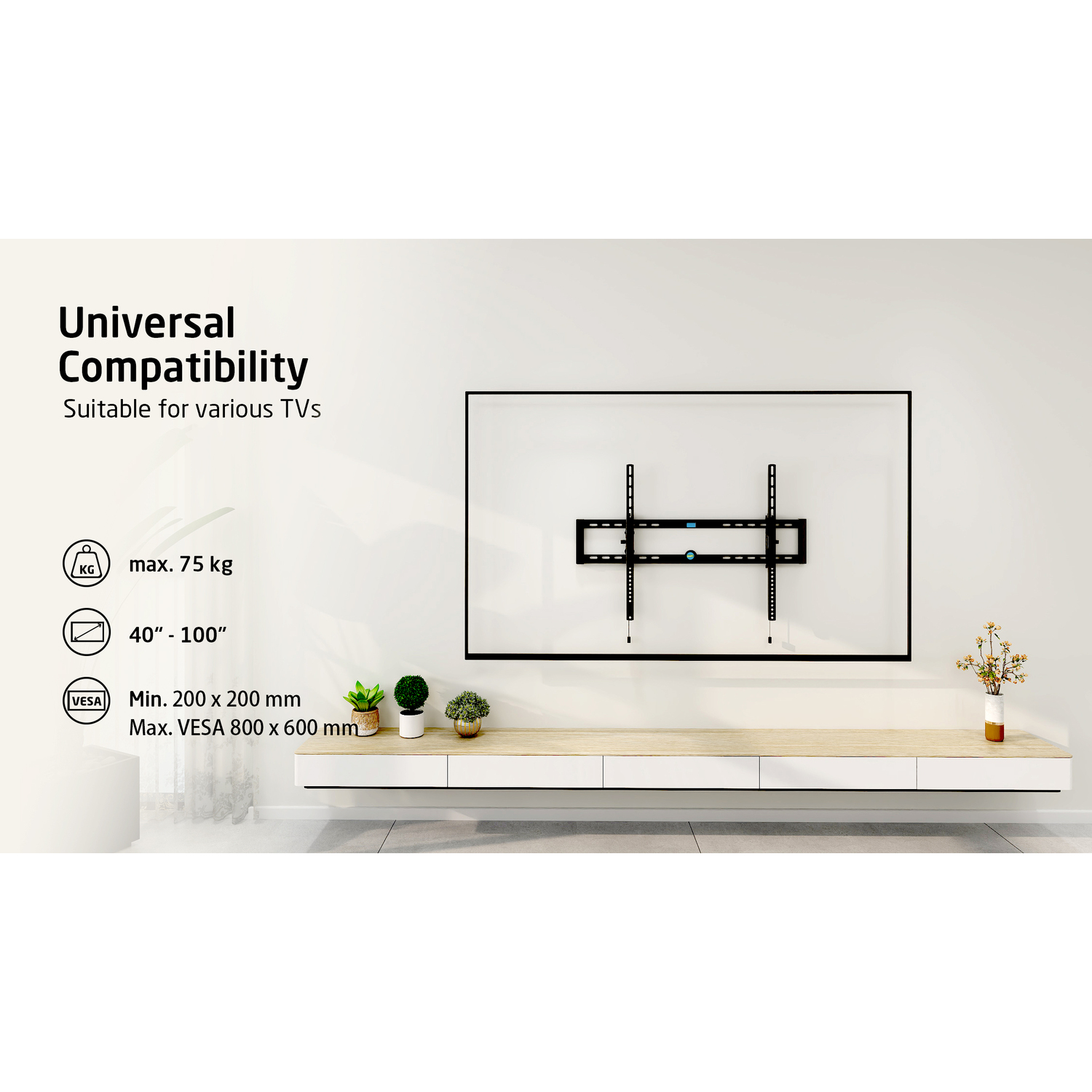 A TV mount on a white wall, with text describing its universal compatibility.