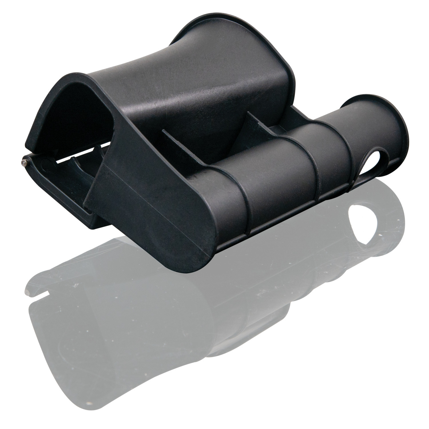 Black plastic tool with a curved design. It is reflecting on a white surface.