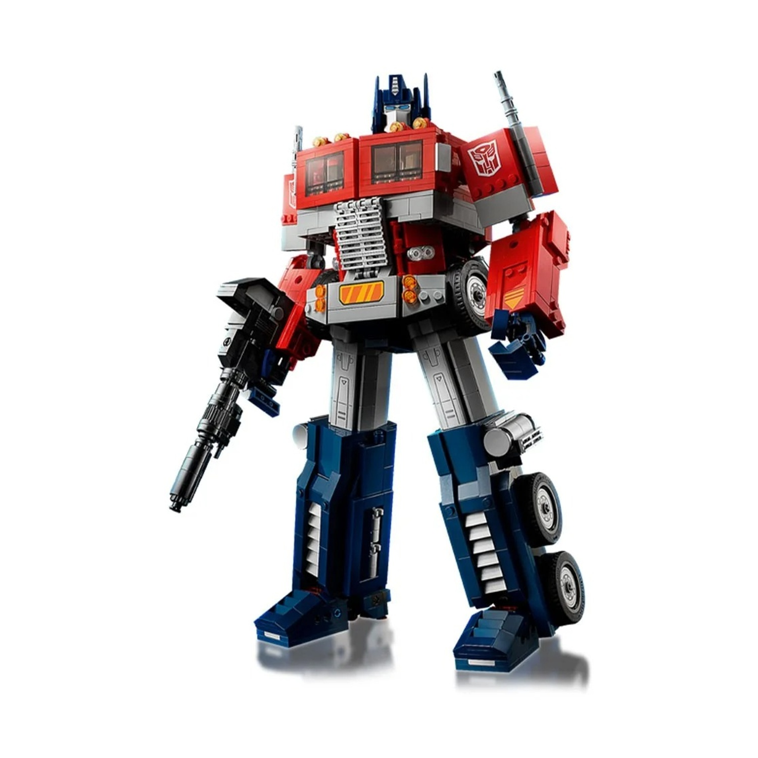 Personaggio Lego di Optimus Prime, rosso e blu, in piedi, che tiene una pistola.