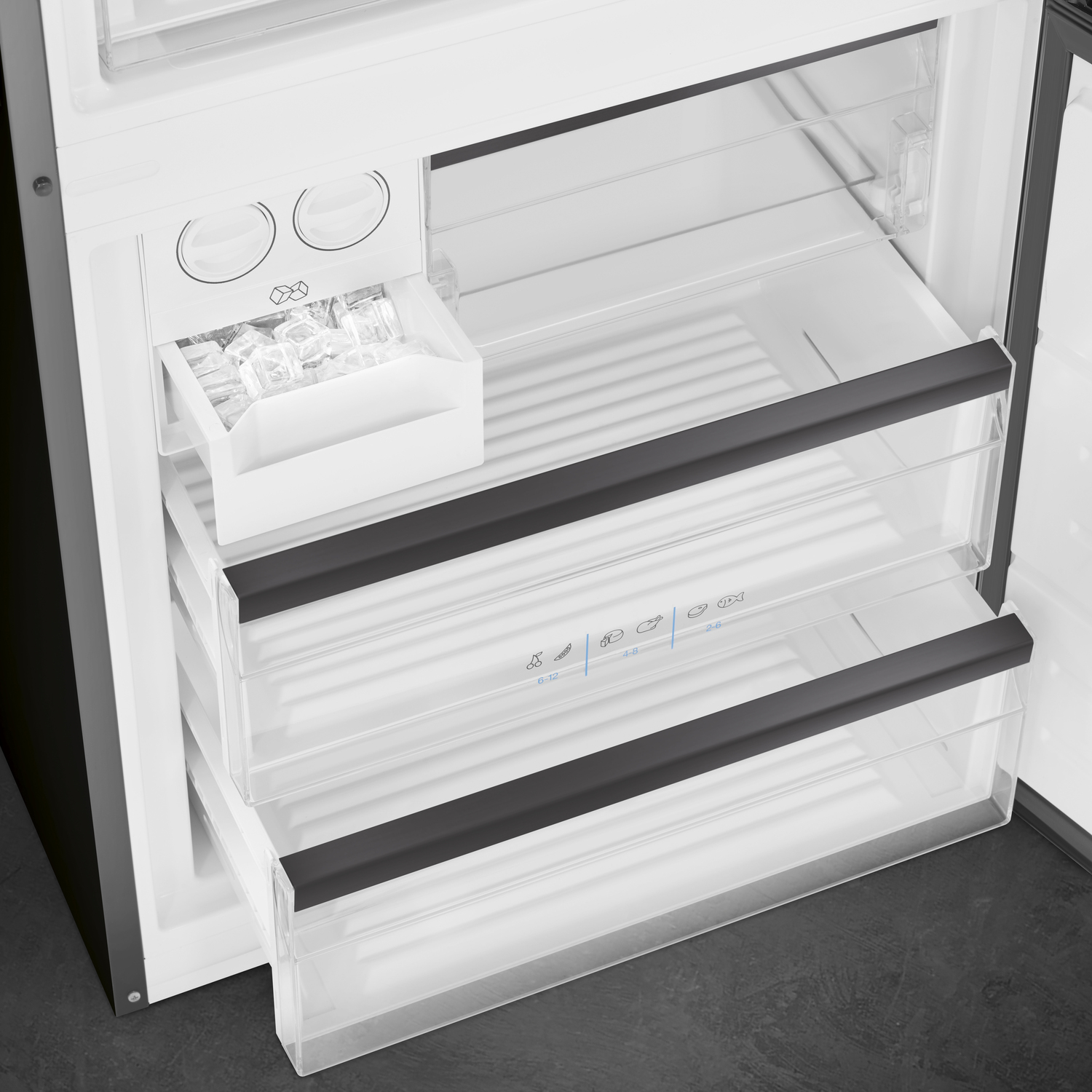 Open refrigerator interior with drawers. Contains ice and fresh food storage.
