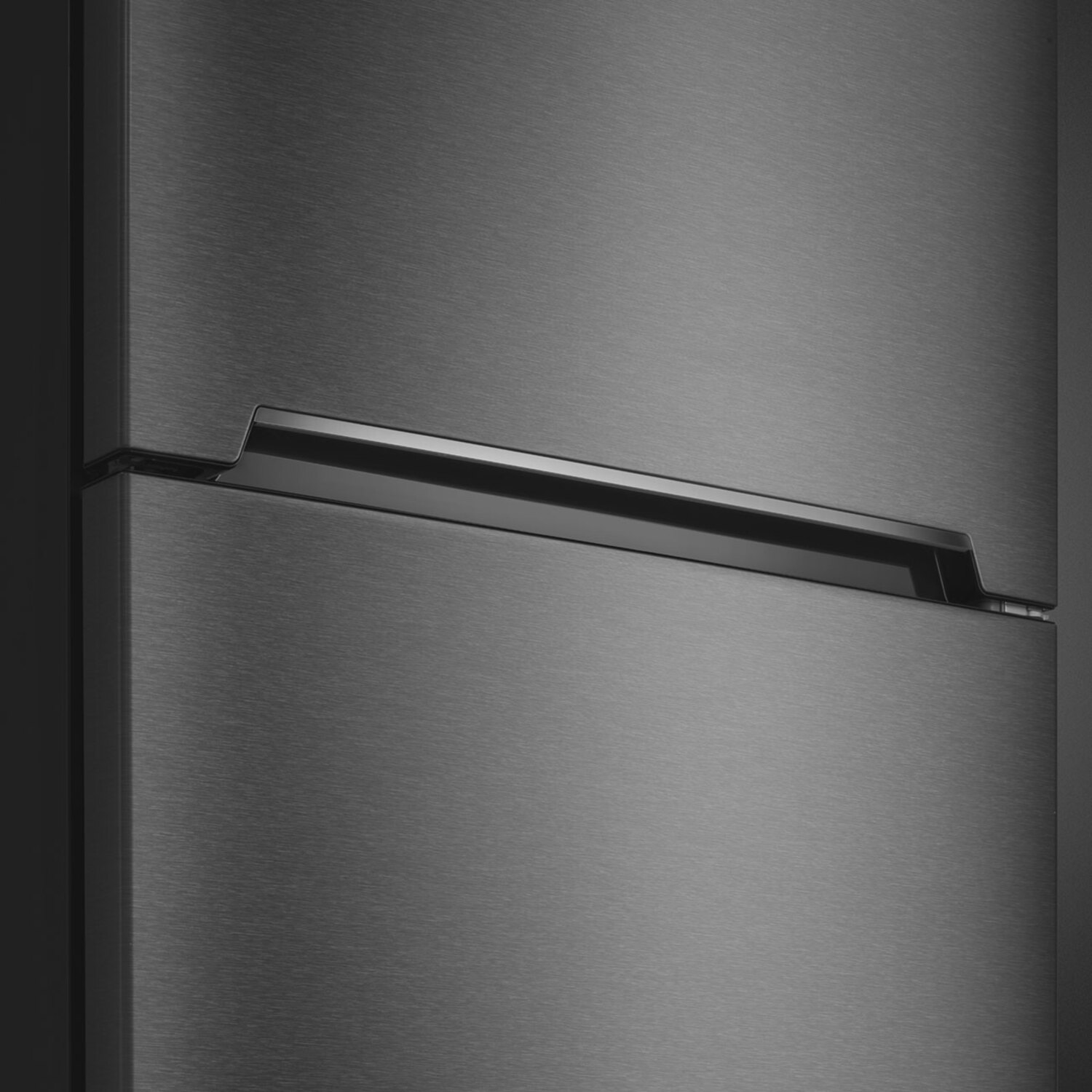 Close-up of a dark gray refrigerator. It has a long handle across the top.