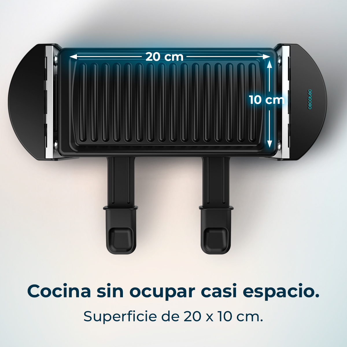 Parrilla negra con medidas: 20 cm x 10 cm. Texto: Cocina sin ocupar casi espacio.