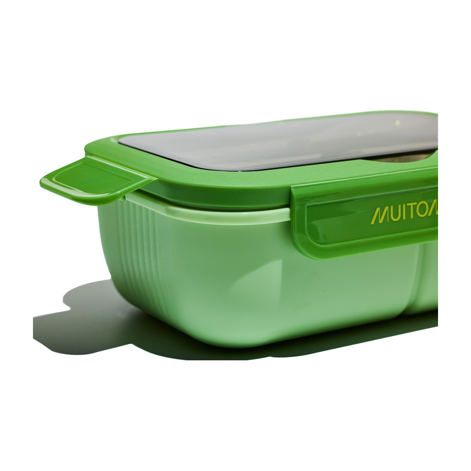Portapranzo verde con coperchio trasparente. La scatola è chiusa e il marchio è visibile.