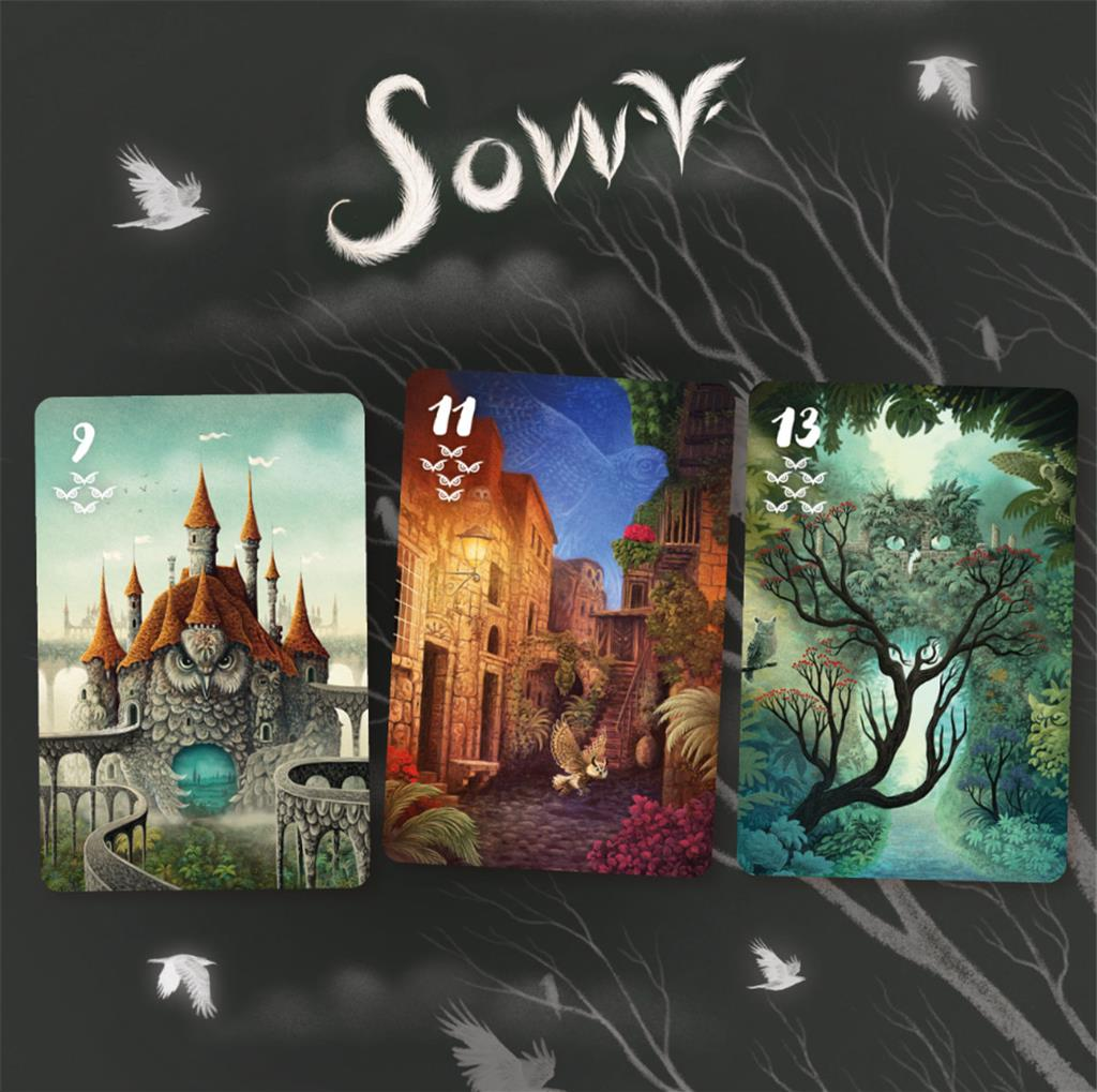 Rozkład kart tarota. Karty przedstawiają surrealistyczną sztukę i obrazy zamków, ulic i drzew.