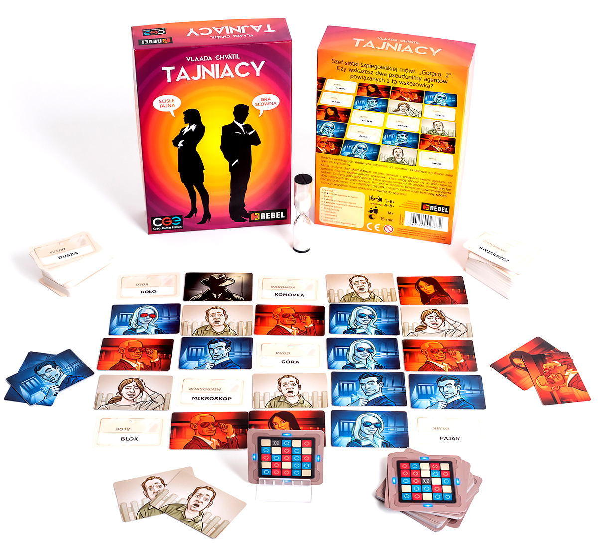 Gra planszowa z kartami i elementami gry rozłożonymi na stole. Pudełka w tle.