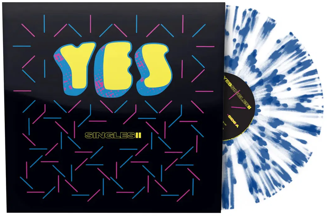 Bakelit album borító 'YES' és 'SINGLES II' felirattal. Kék-fehér fröcskölt lemez.