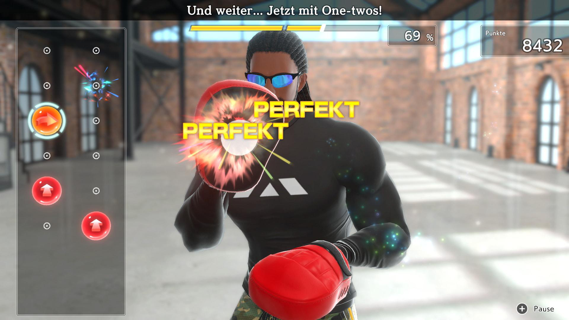 Ein Videospielbildschirm zeigt einen Boxer, die Worte 'PERFEKT' und eine Punktzahl von 8432.