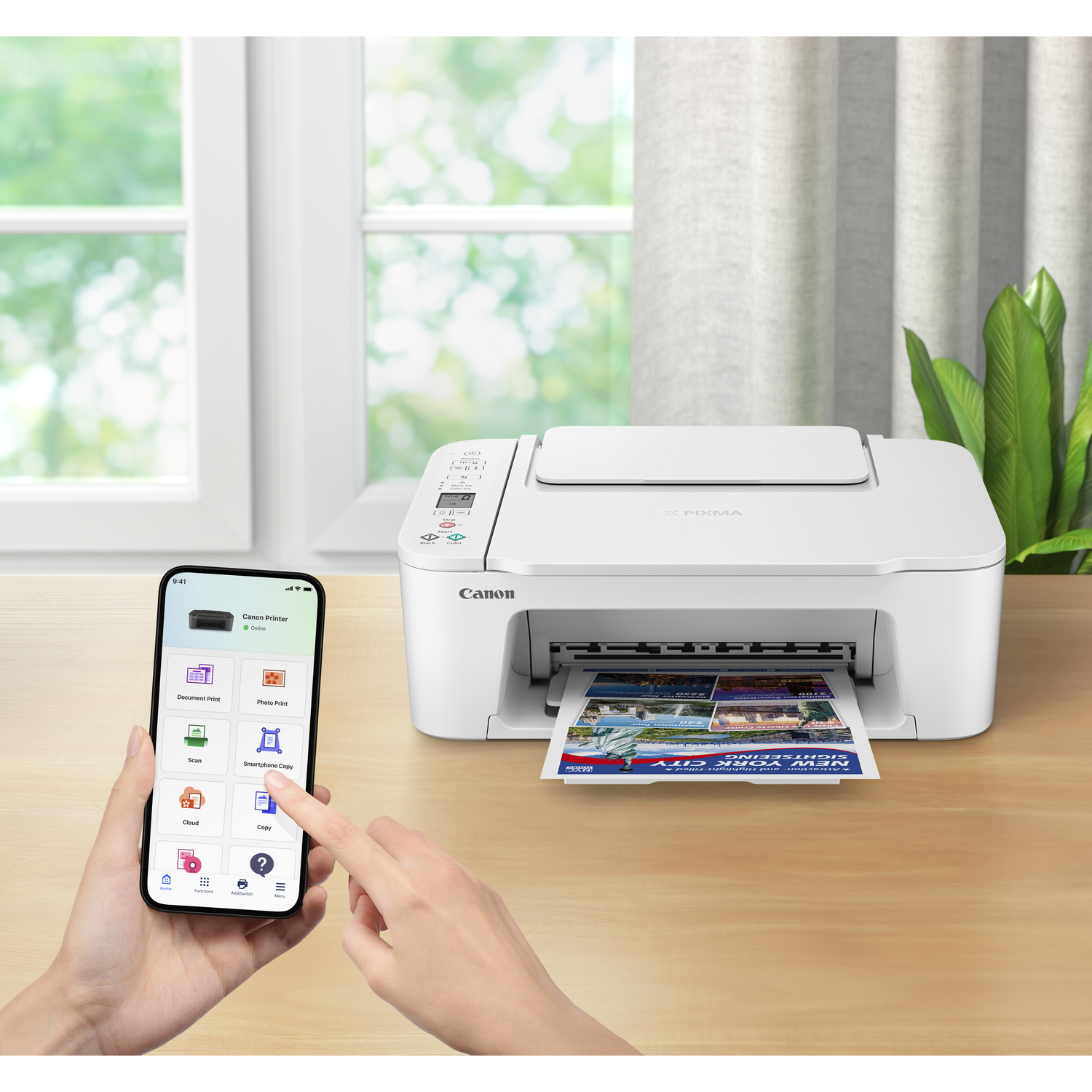 Een Canon-printer naast een smartphone met een app.
