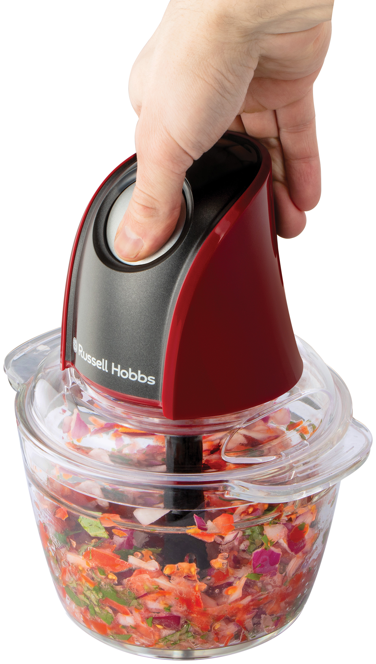 Kéz használja a Russell Hobbs aprítót, aprított zöldségekkel.