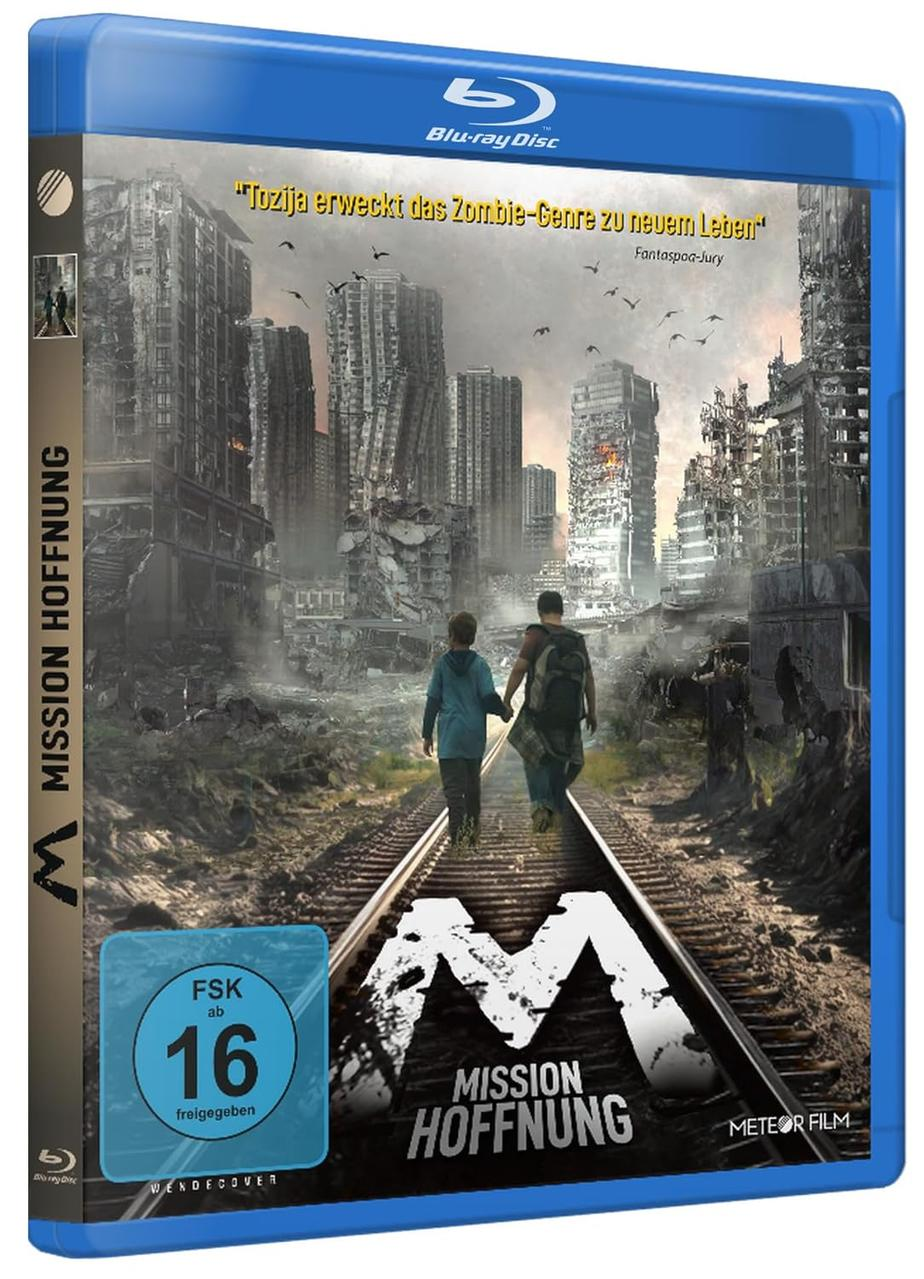 Filmcover: Zwei Figuren gehen auf Bahngleisen durch zerstörte Stadt, Titel 'Mission Hoffnung'.