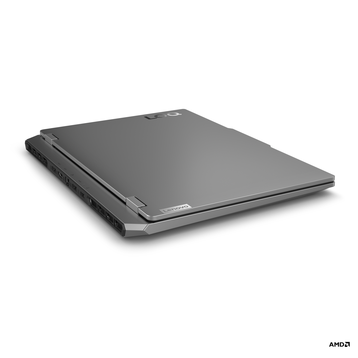 Een zilveren laptop is gesloten en op een zwart oppervlak geplaatst.