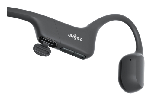 Auriculares de conducción ósea Shokz gris oscuro. El lado derecho tiene un diseño curvo.