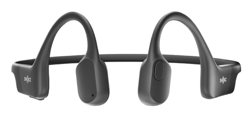Auriculares de conducción ósea Shokz negros, colocados sobre fondo blanco.