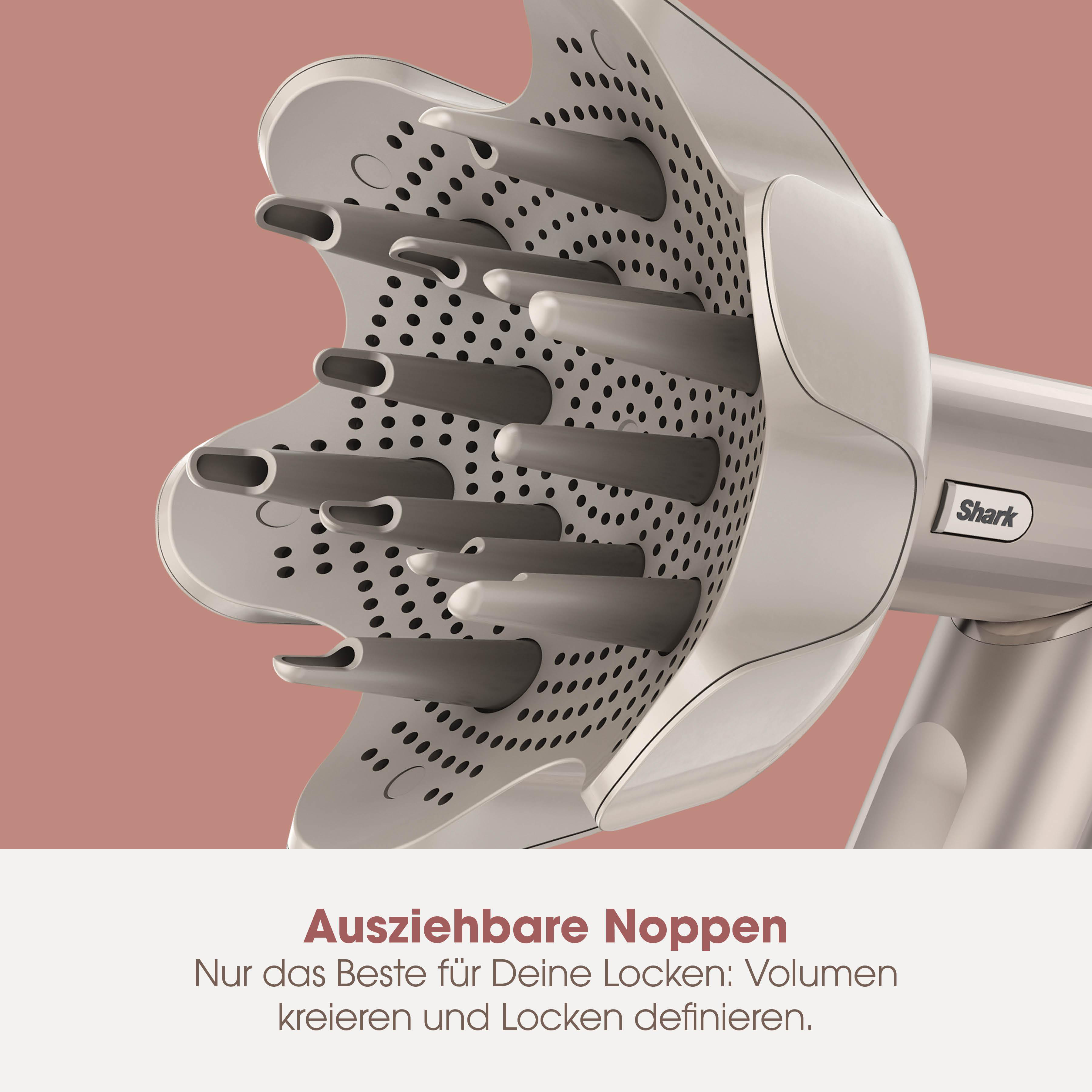 Nahaufnahme eines weißen Haartrocknerdiffusors mit deutschem Text: 'Auszierbare Noppen'.