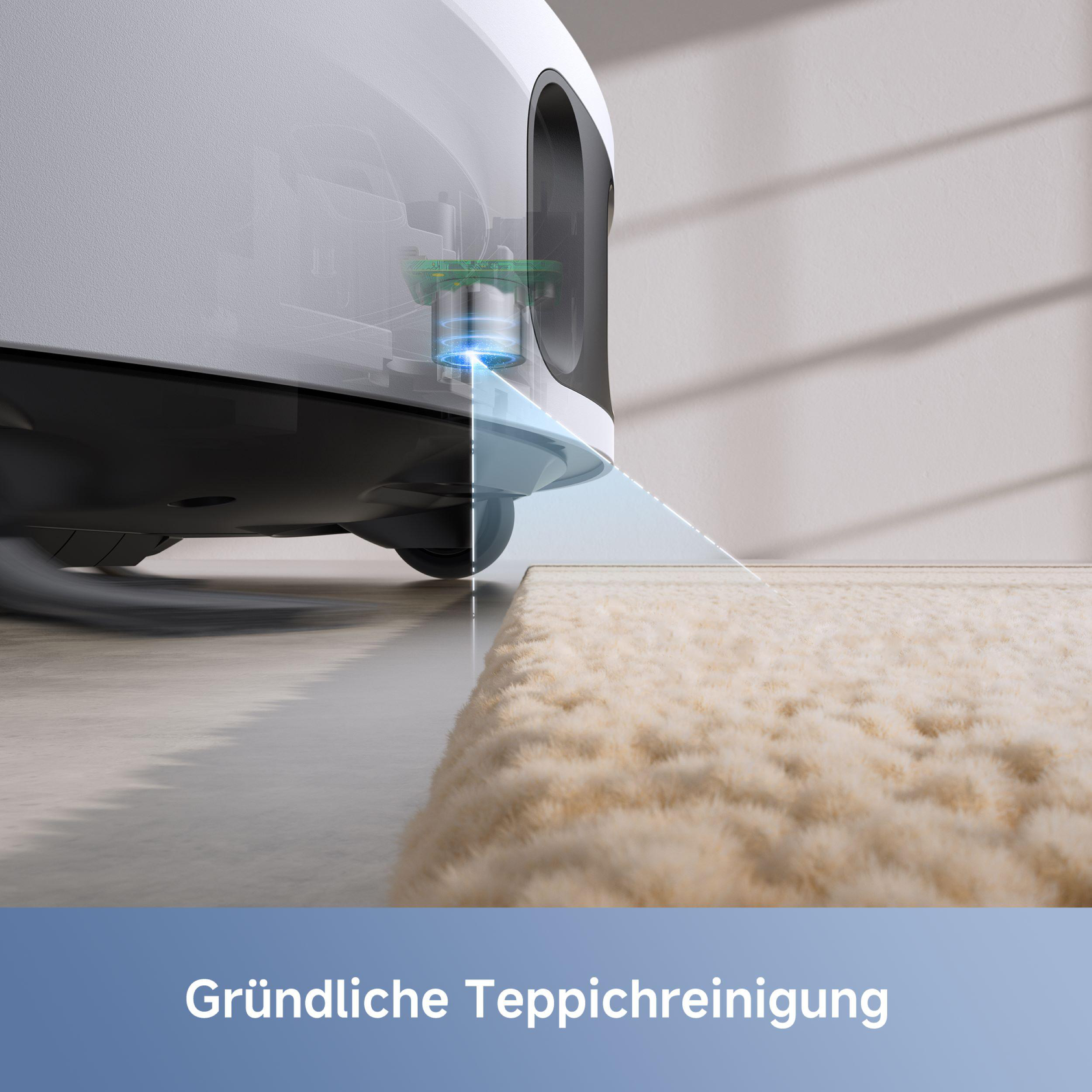 Ein Roboter-Staubsauger reinigt einen Teppich. Ein blaues Licht zeigt den Reinigungspfad an.
