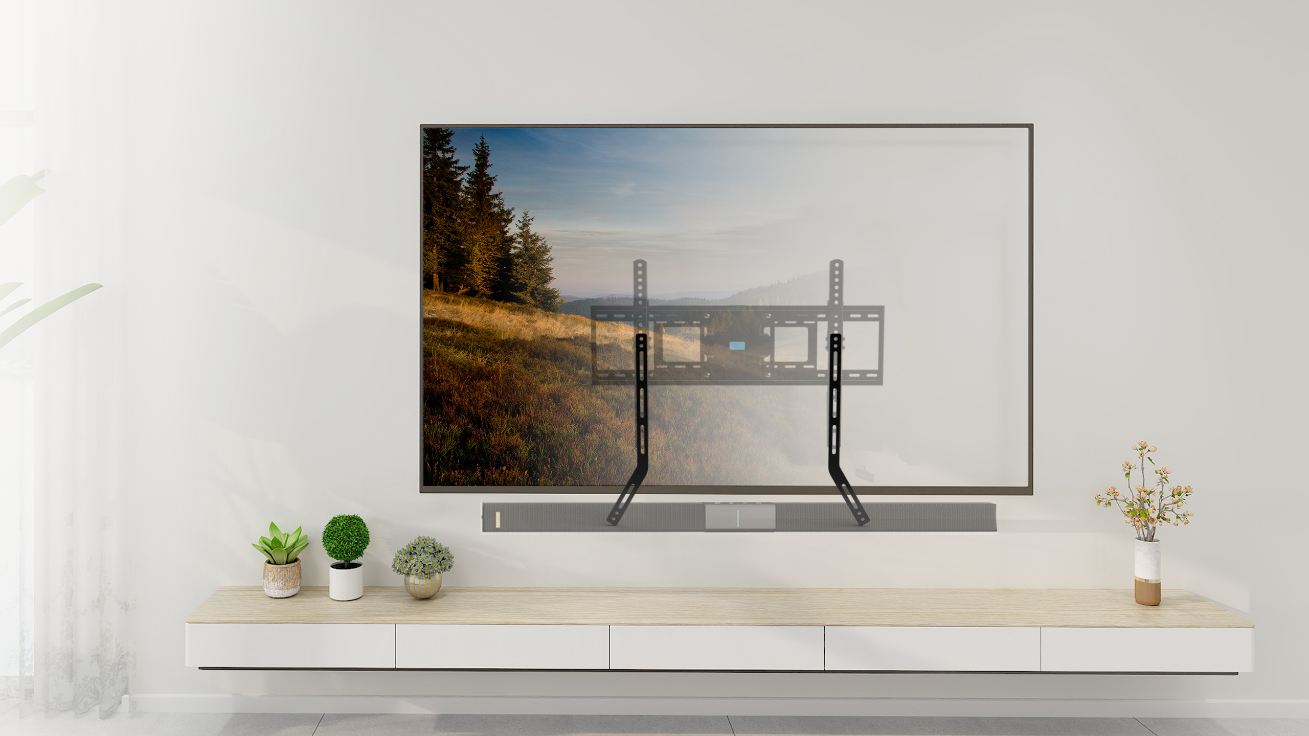 Fernseher an einer weißen Wand montiert. Eine Soundbar und ein schwebendes Regal darunter.
