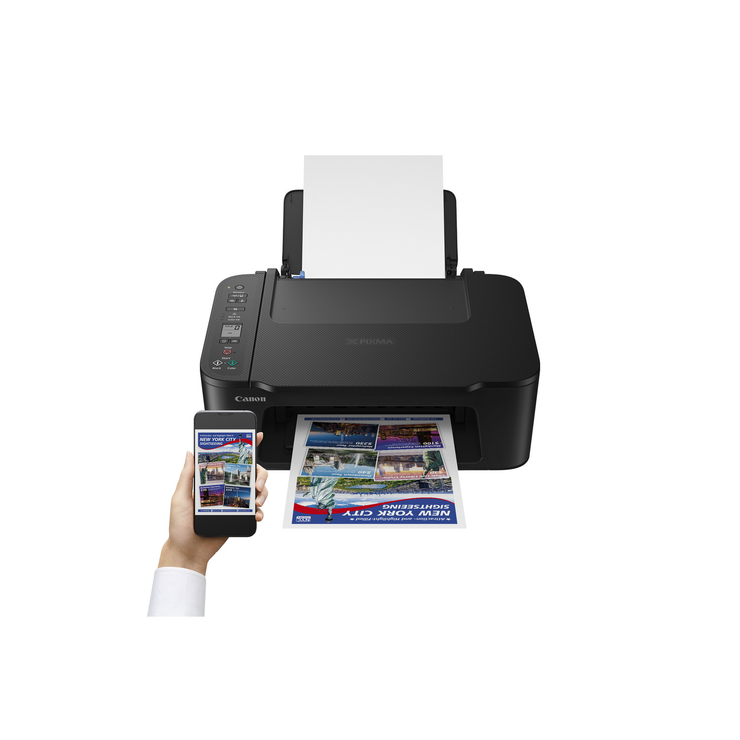 A black Canon printer printing a color page with a smartphone next to it.