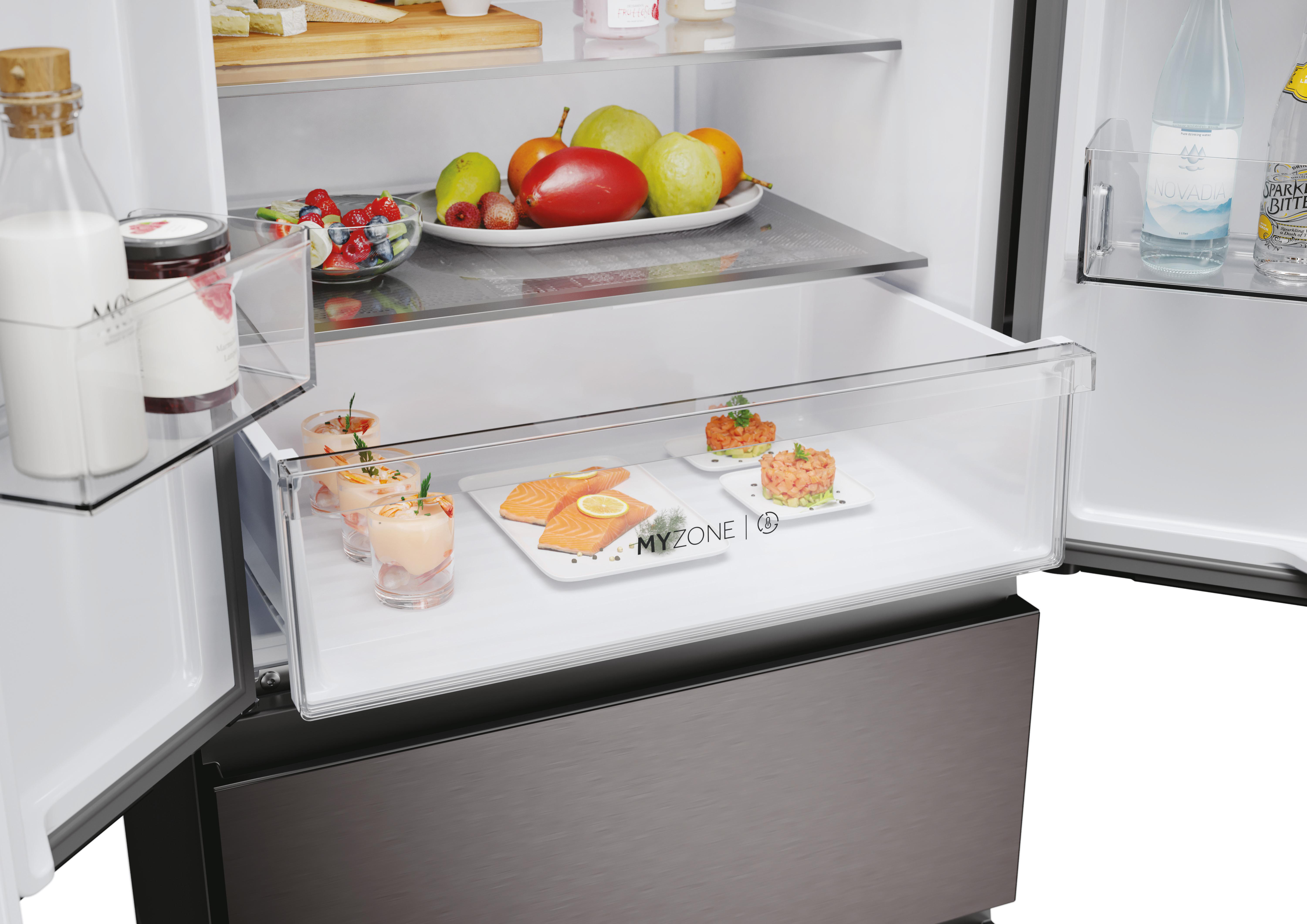 Kühlschrank Schublade mit Speisen: Vorspeisen, Lachs und andere Gerichte.