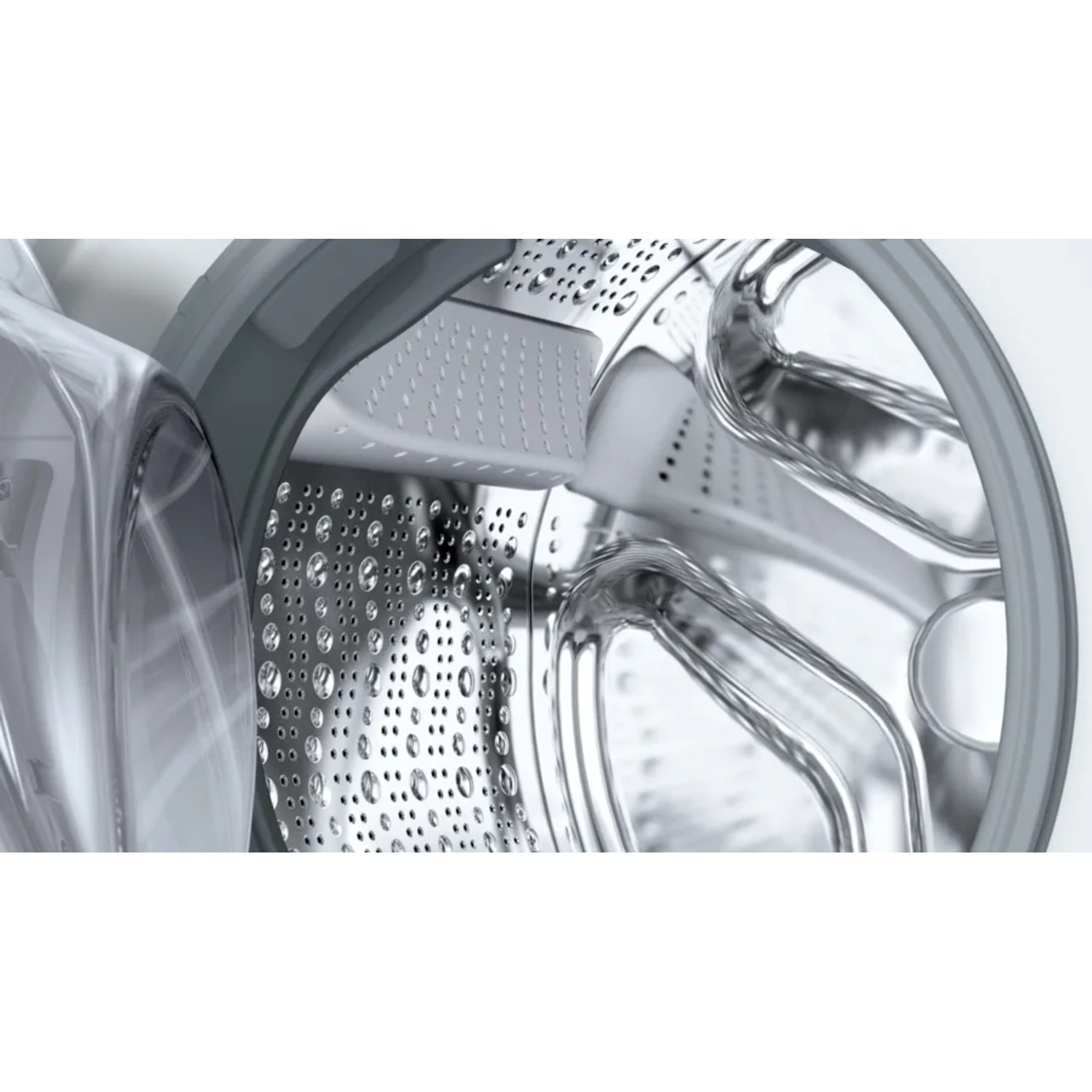 Close-up van een wasmachinetrommel met perforaties en een grijze afdichting.