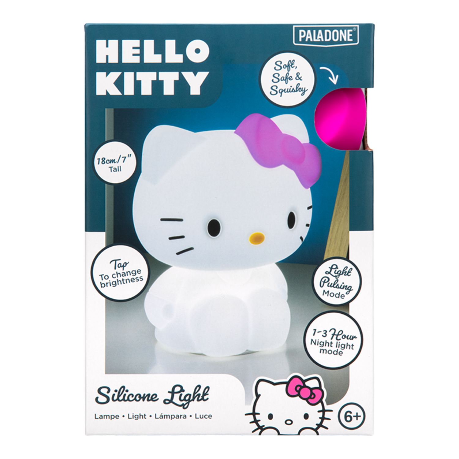 Hello Kitty night light in a box. The light is white, with a pink bow and text on the box.