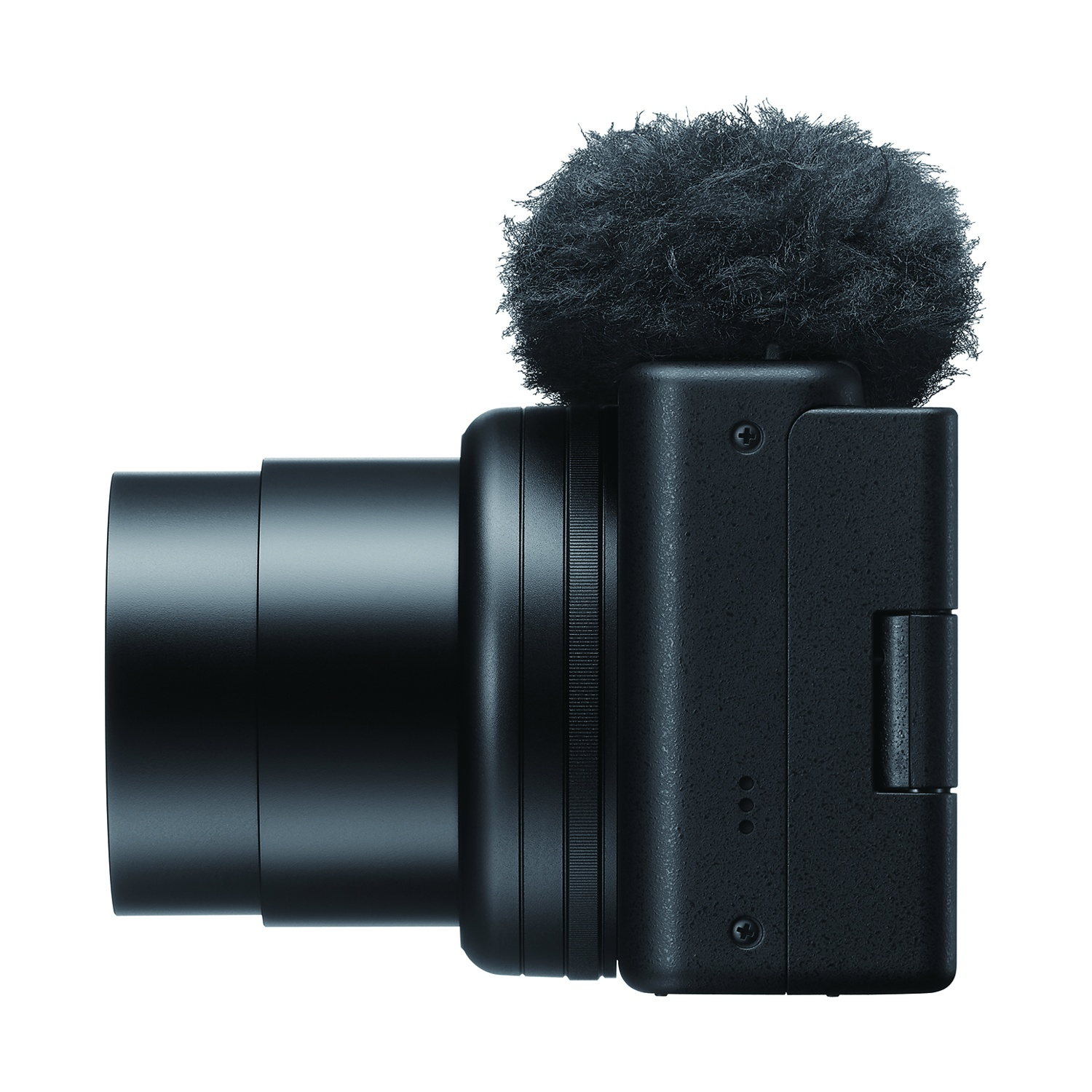 Una fotocamera nera con un microfono peloso attaccato, vista lateralmente.