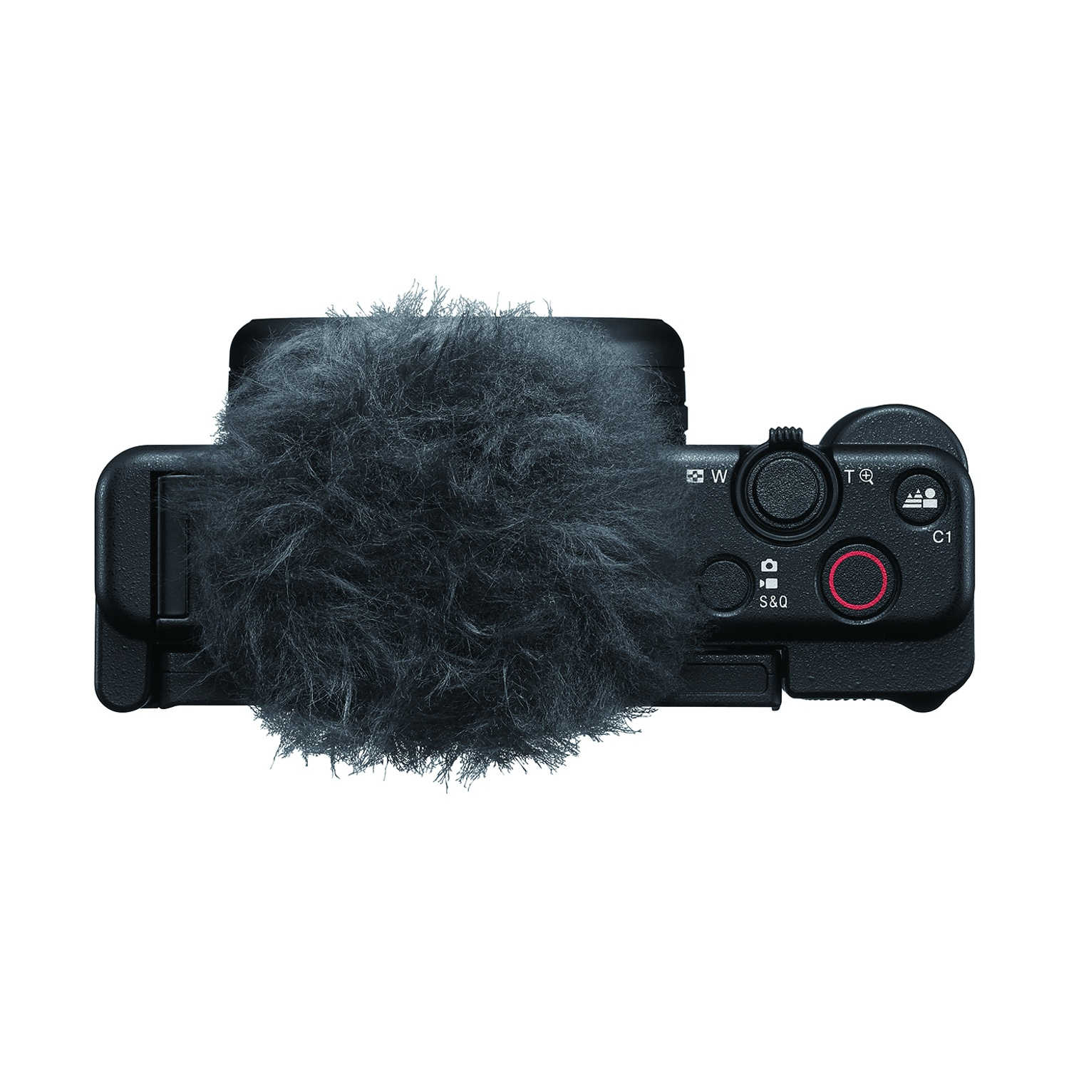 Una fotocamera nera con un microfono sfocato sopra.