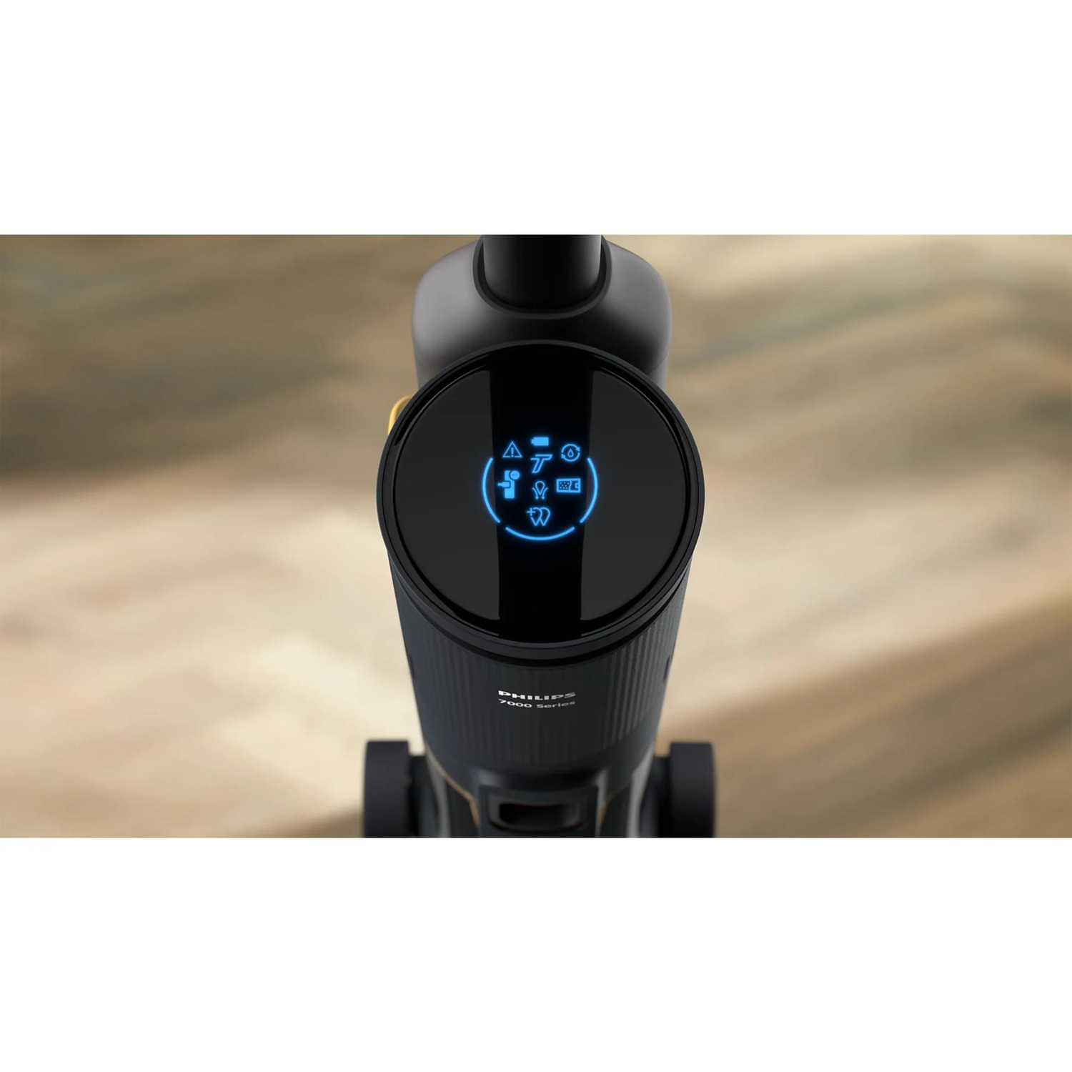 Top view of a black vacuum cleaner. The top has a circular display showing icons.