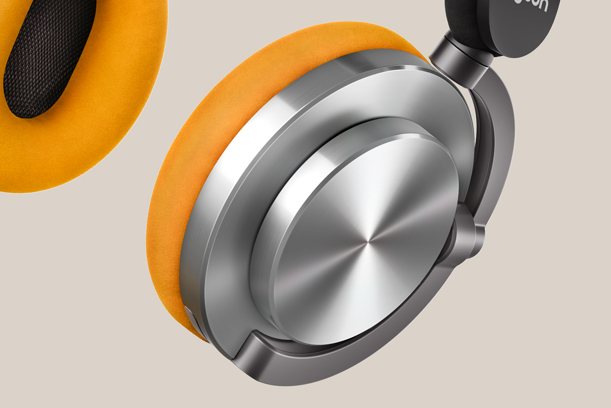 Auriculares, plata y negro, almohadillas naranjas.