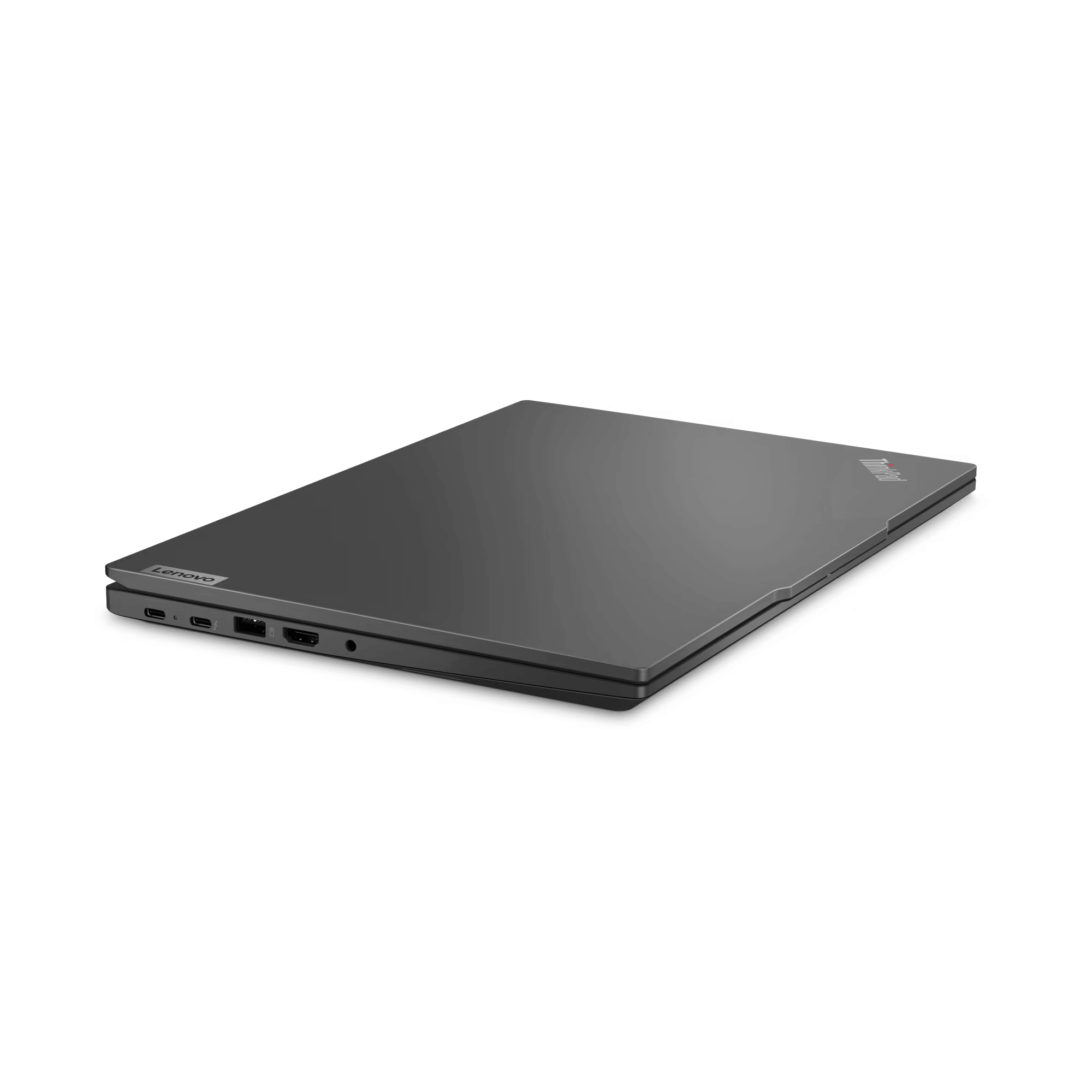 Portátil cerrado, color gris oscuro, con logo Lenovo en el lado derecho.