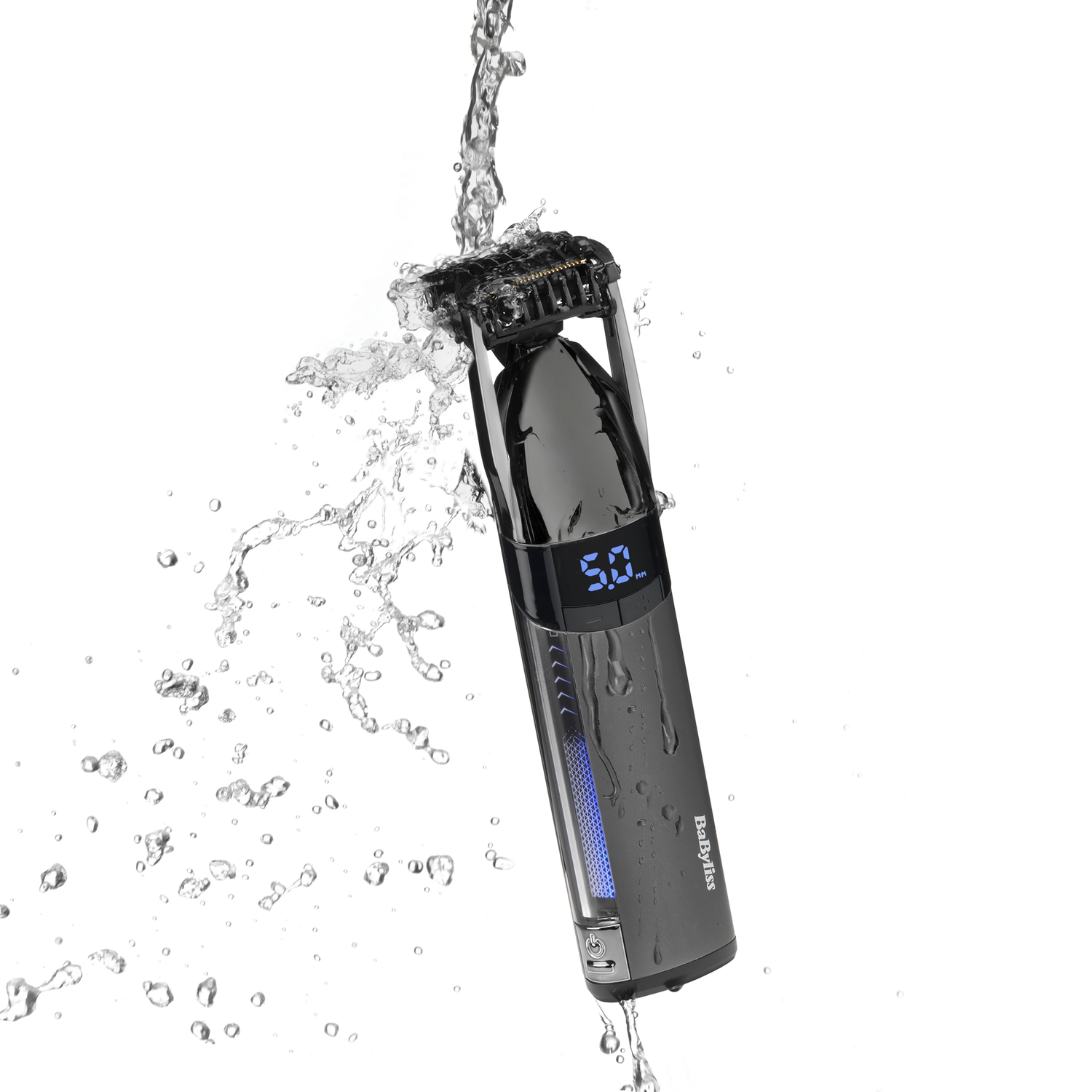 A black and silver Babyliss trimmer being sprayed with water, with a digital display.