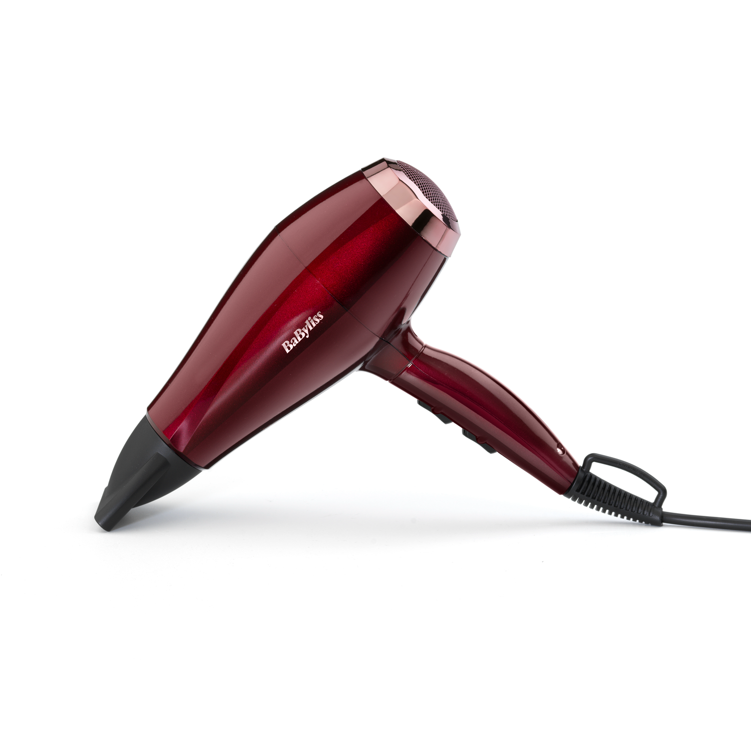 Red and black hair dryer, top view. The brand name Babyliss is visible on the body.