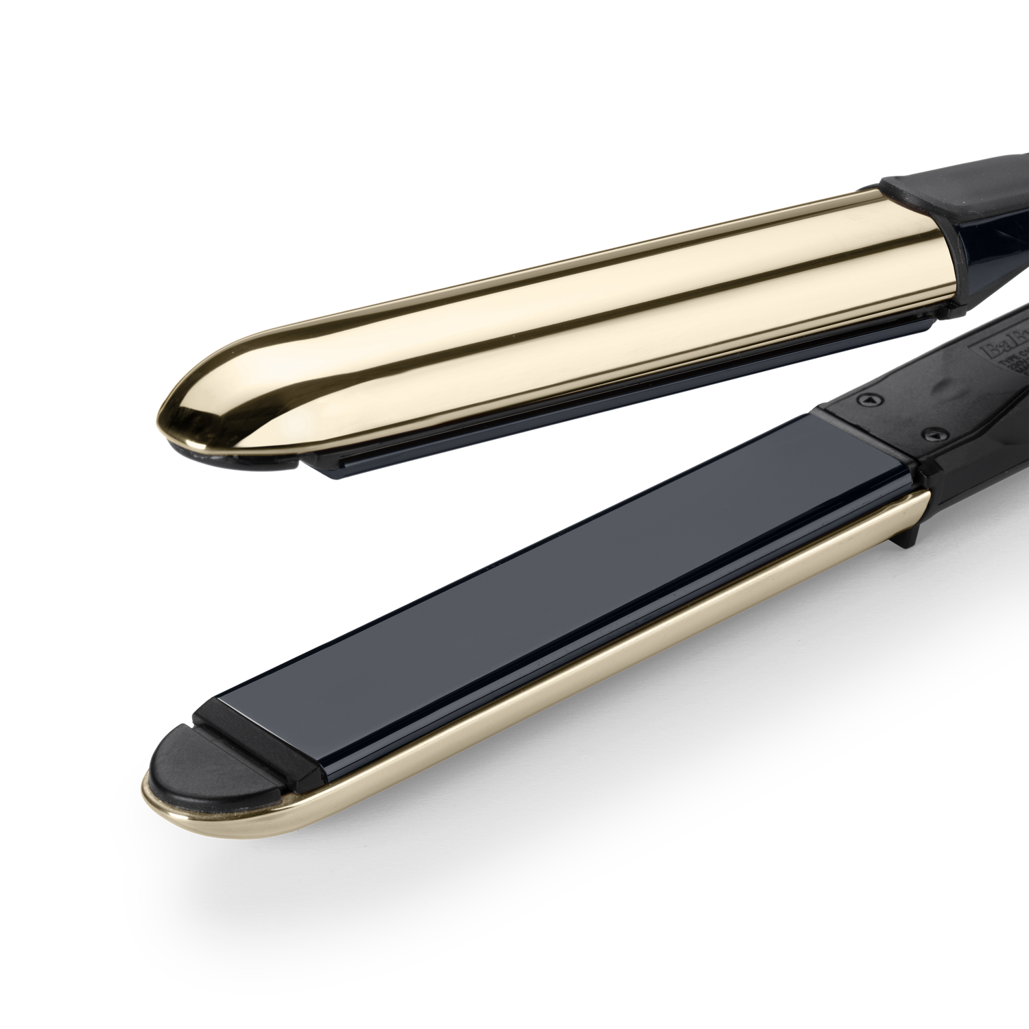 A hair straightener with gold and black elements. The top plate is open.