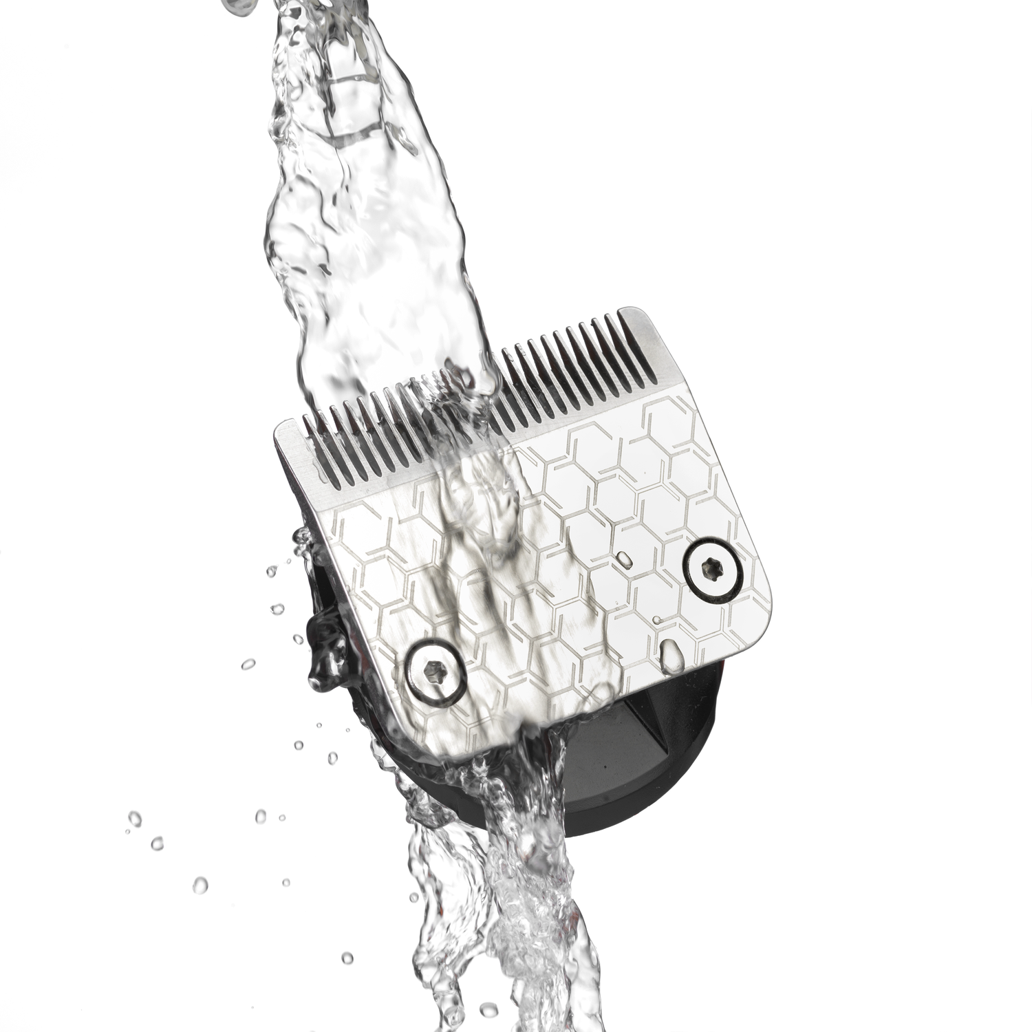Close-up of a shaver head being rinsed with water.