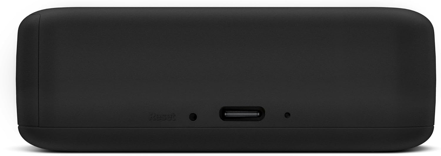 Dispositivo negro con puerto USB y botón de reinicio en el lateral.