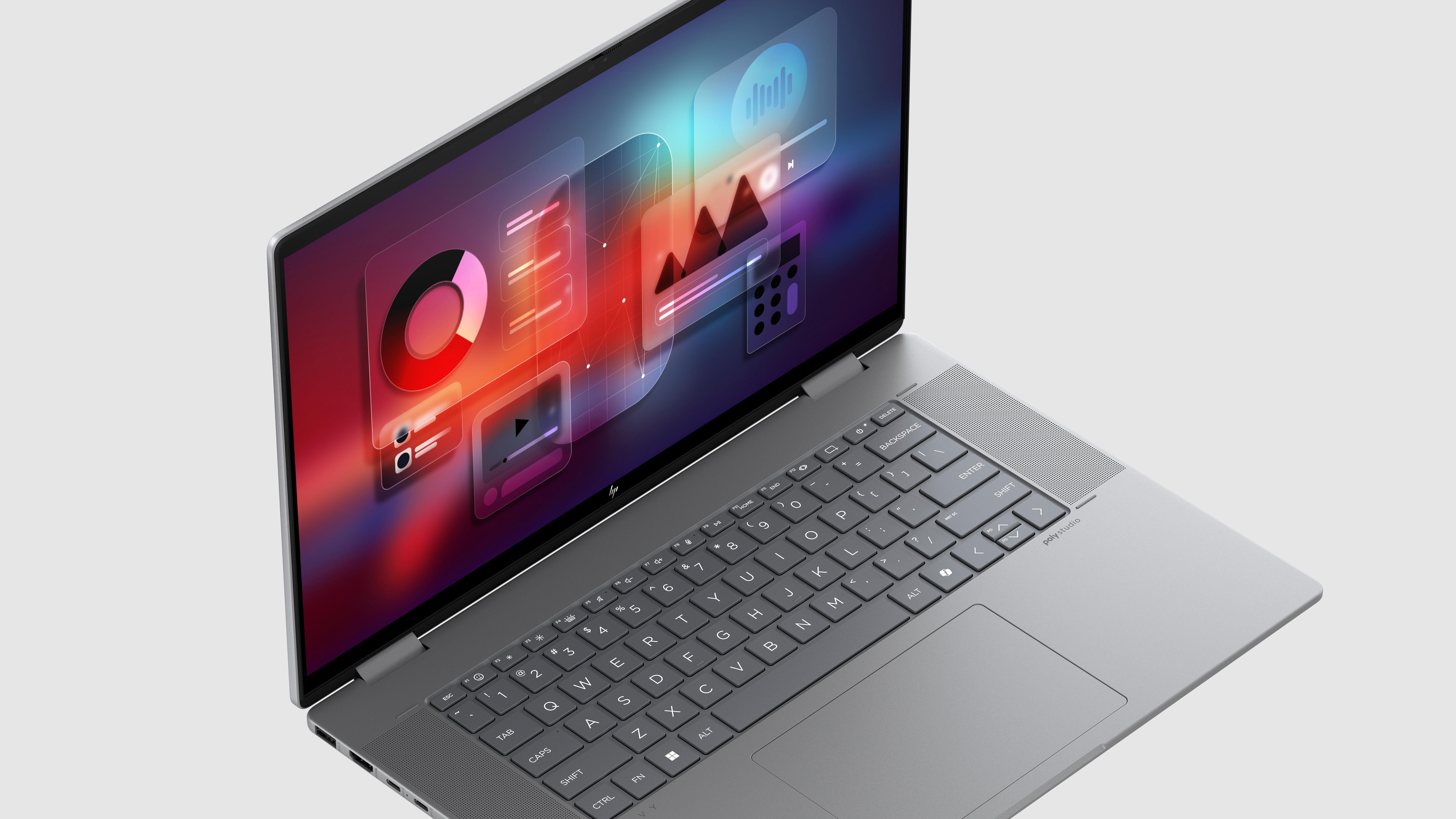 Offener silberner Laptop mit farbenfrohem Bildschirm mit Grafiken und Symbolen auf weißer Fläche.