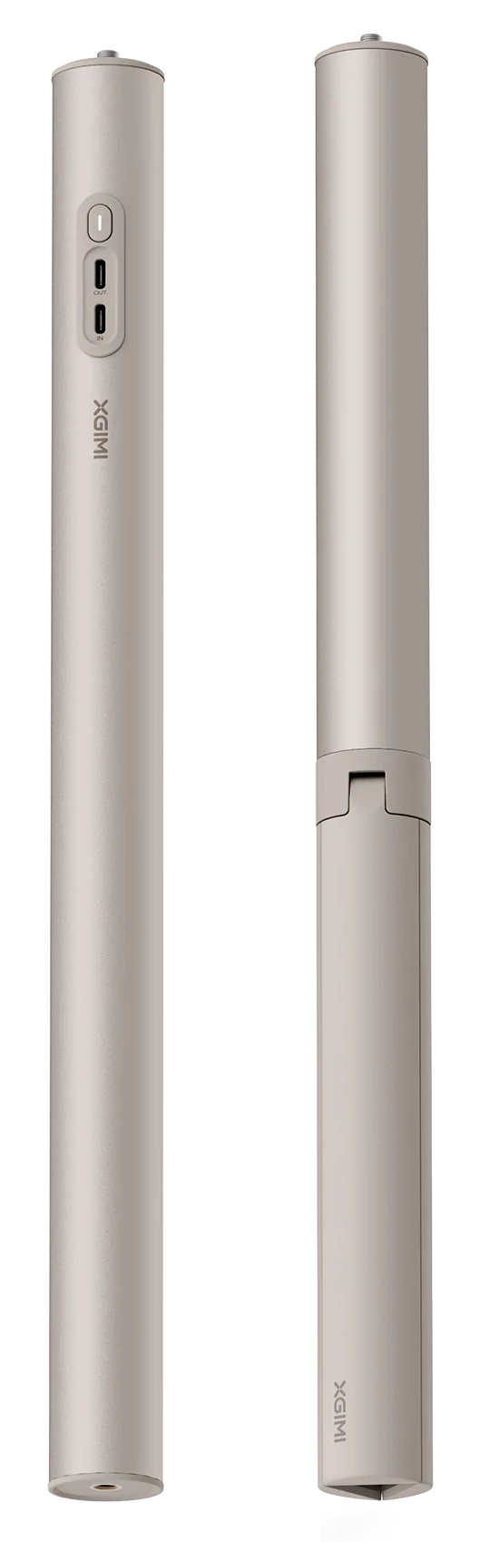 Két hengeres, világos színű tárgy, valószínűleg kiegészítők. Az egyik nyitva van, USB portot mutat. Fémnek tűnnek.