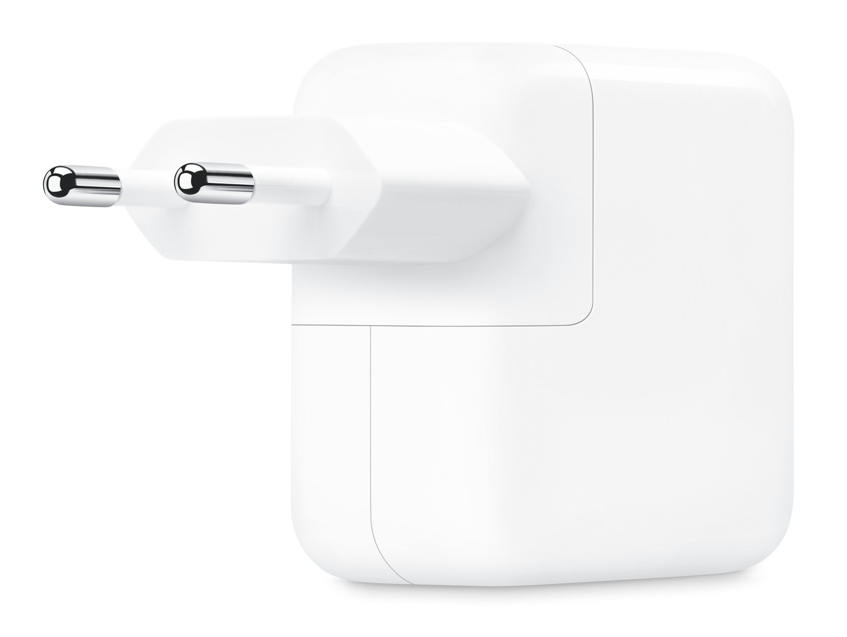Biały adapter zasilania z dwoma srebrnymi bolcami wystającymi z jednej strony.