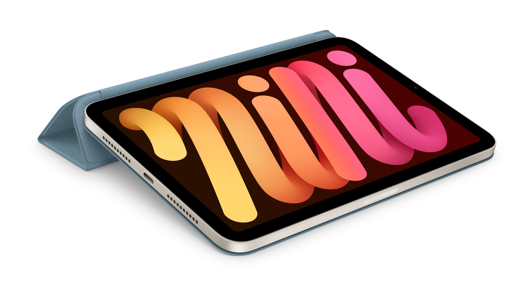 Niebieski tablet z kolorowym wyświetlaczem, otwarty, na jasnoniebieskiej okładce. Białe tło.