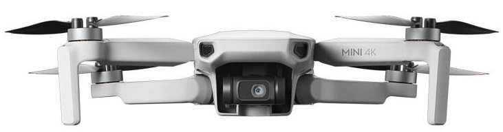 Biały dron z czterema śmigłami. Ma aparat z przodu i napis 'MINI 4K'.