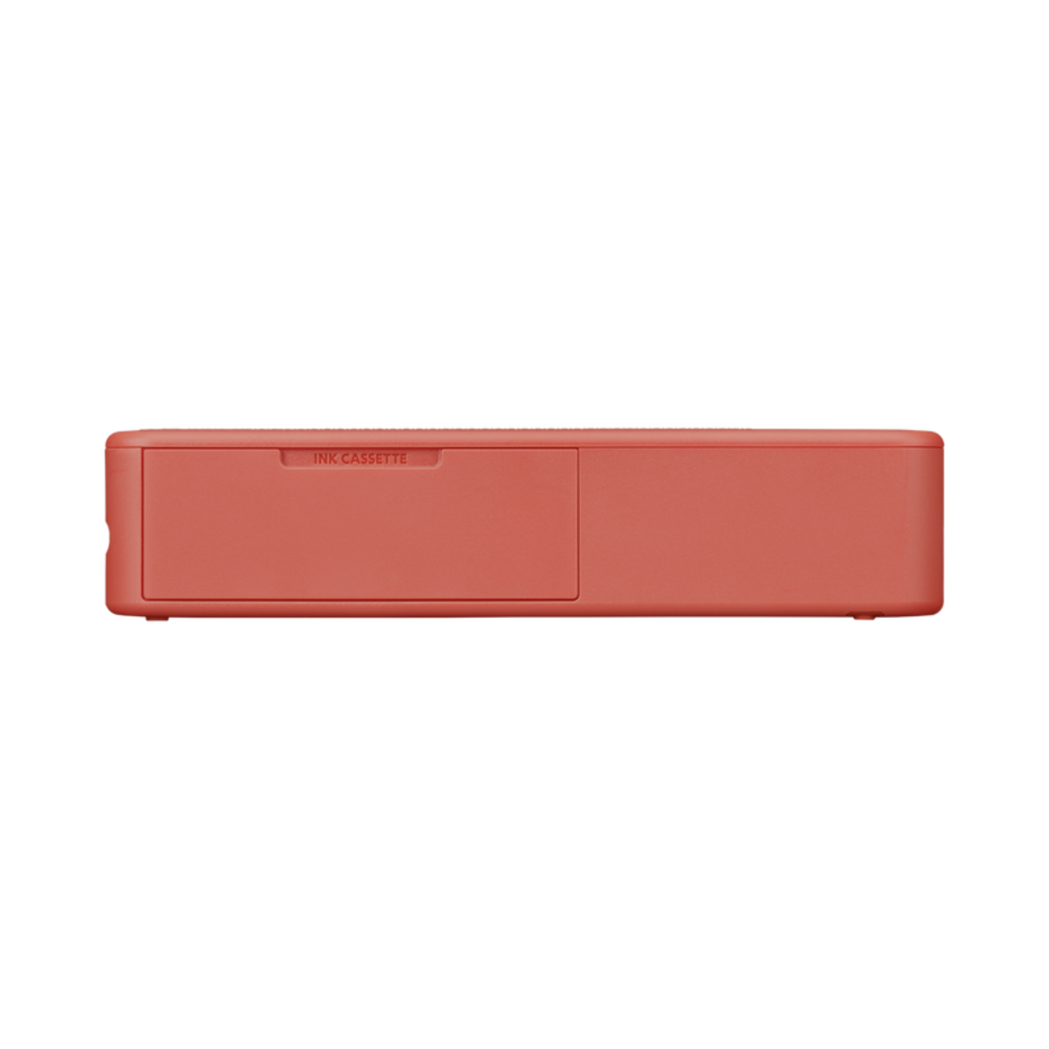 A coral-colored ink cassette with a drawer labeled 'INK CASSETTE' on a black background.