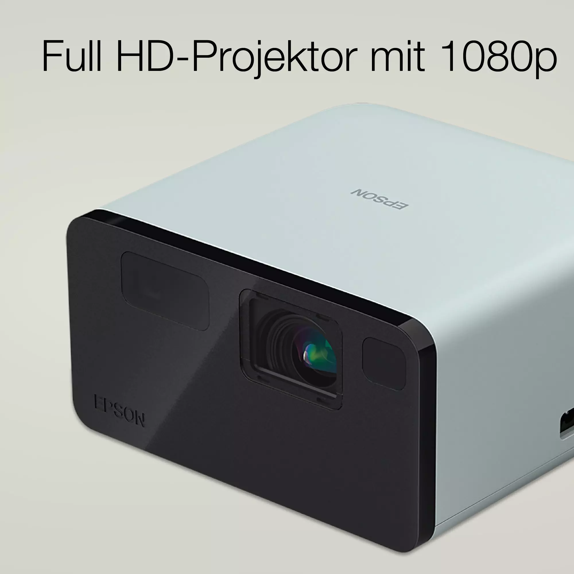 Ein kleiner Projektor mit schwarzer Blende auf hellem Hintergrund.